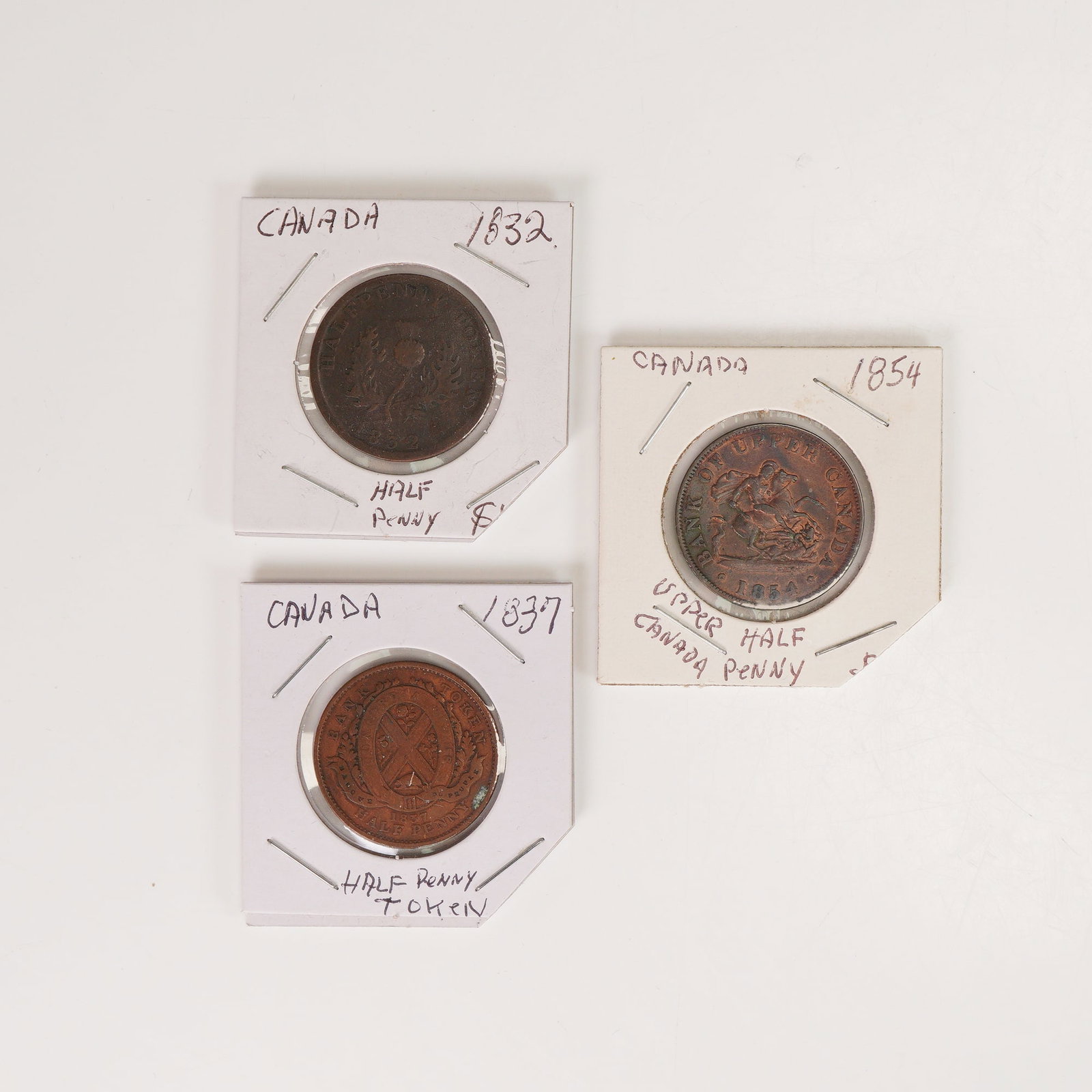 3pc 1832 to 1854 Canadian Half Pennies: The first, dated 1832, is from the Province of Nova Scotia and features a laureate bust of King William IV on the obverse with the inscription PROVINCE OF NOVA SCOTIA, and a thistle wreath encircling 
