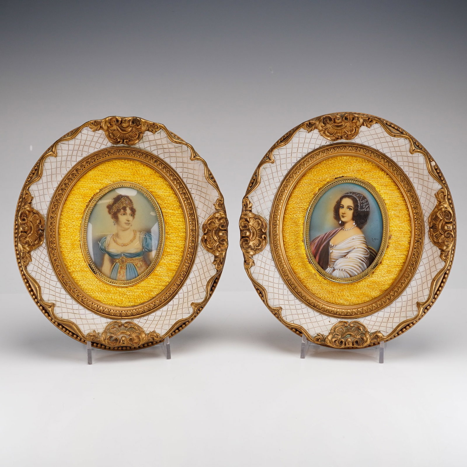 2pc Framed Hand Painted Miniature Portraits: A pair of 19th century hand painted miniature portraits of women set in decorative oval gold and yellow frames, with one painting signed. Dimensions: 7.25"L x 1.25"W x 8.00"H Weight: 1.00 lb 6.50oz