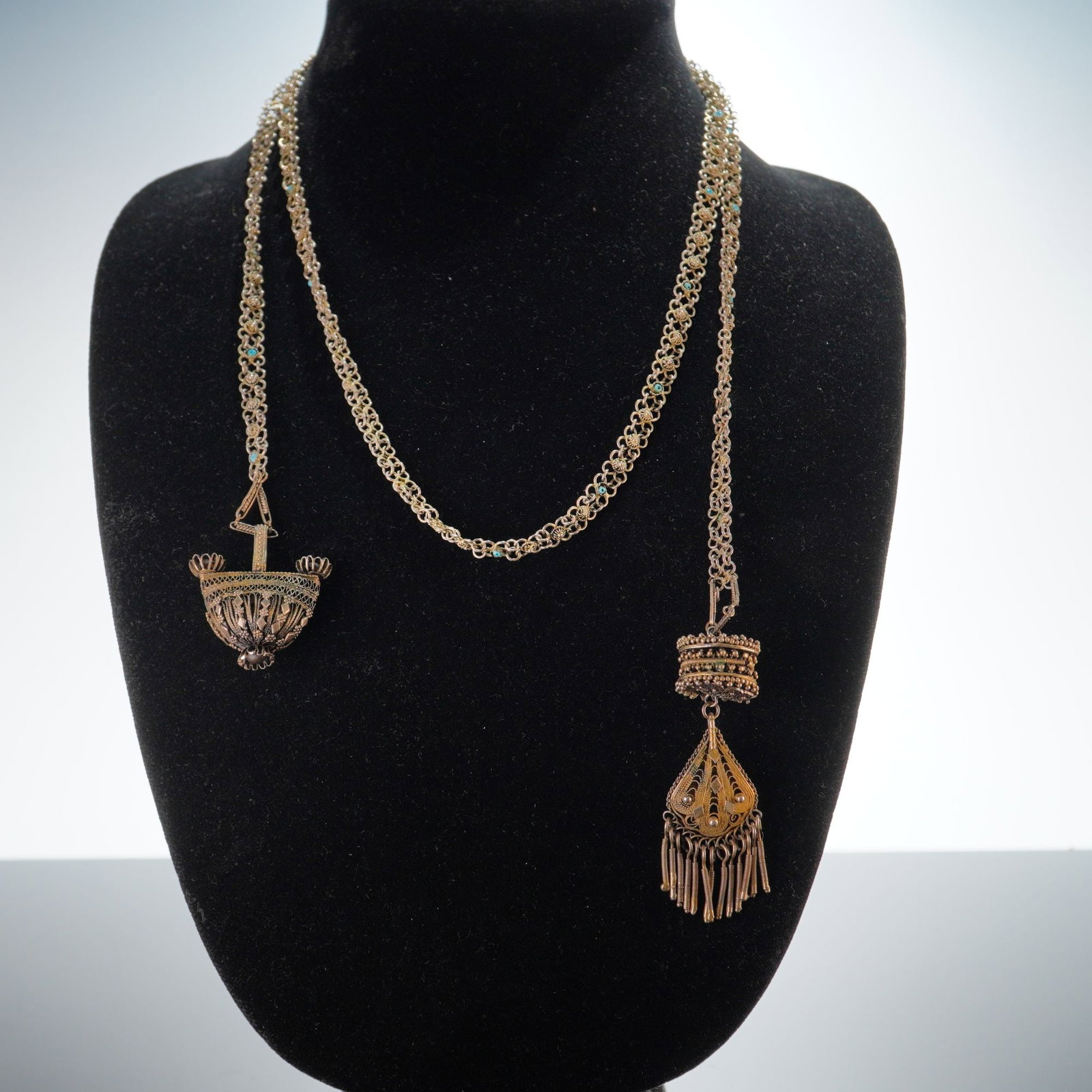 Stanetzky Israel Tassel Necklace with Sterling Silver Pendant: This long lariat or sautoir-style necklace is crafted by Stanetzky in Israel. The piece is composed of .925 sterling silver with a gold tone finish and features intricate Yemenite-style filigree work 