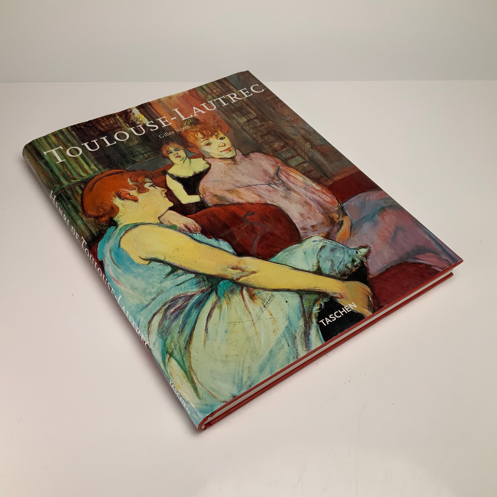 Neret, Gilles. Toulouse-Lautrec. Taschen, 1999, Hardcover Book: This large-format hardcover art monograph, titled Toulouse-Lautrec and authored by Gilles Neret, was published by Taschen in 1999. The volume is bound in red boards and retains its original pictorial 