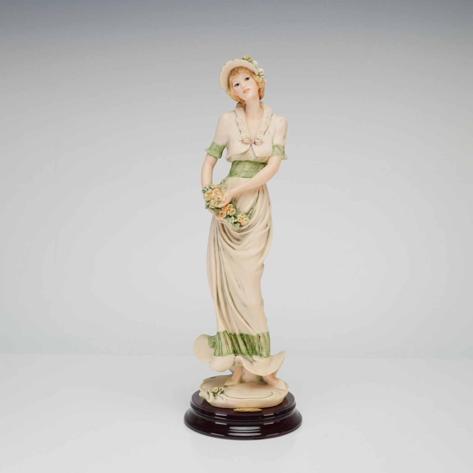 Giuseppe Armani Florence Sculture d'Arte Figurine Blossom 0657C: This figurine, titled Blossom, is model number 0657C by artist Giuseppe Armani for the Florence Sculture d'Arte studio in Italy. The piece is crafted from cold-cast porcelain with a matte bisque finis