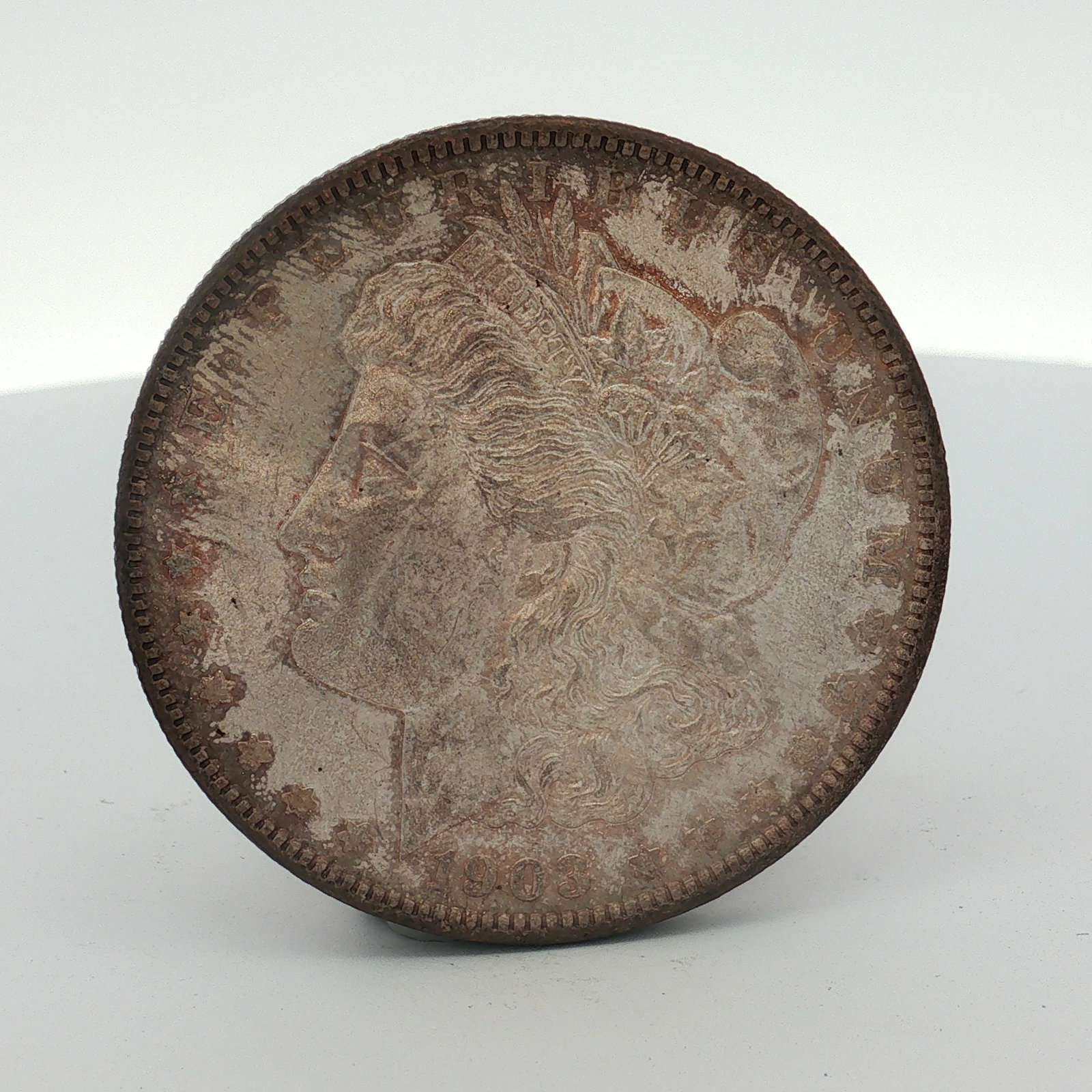 1903-O US Morgan Silver Dollar Coin Circulated: This US silver Morgan dollar is dated 1903 and was struck at the New Orleans Mint. The coin is composed of 90% silver and 10% copper. It features the Liberty Head obverse and the Morgan dollar reverse