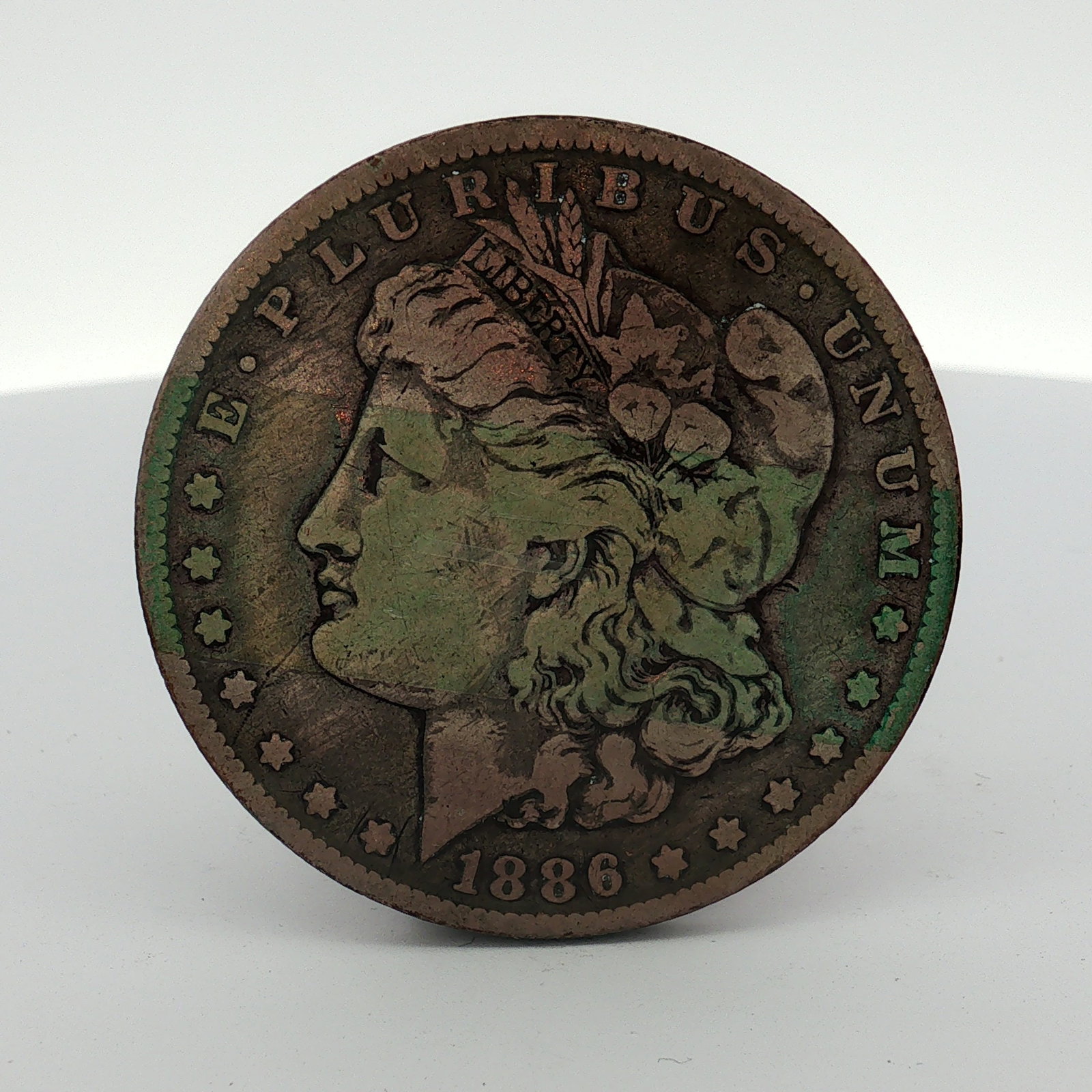 1886-O US Morgan Silver Dollar Coin Circulated: This coin was struck at the New Orleans Mint and features the Liberty Head obverse and Heraldic Eagle reverse. An O mint mark is located on the reverse above the letters DO in DOLLAR. The composition 