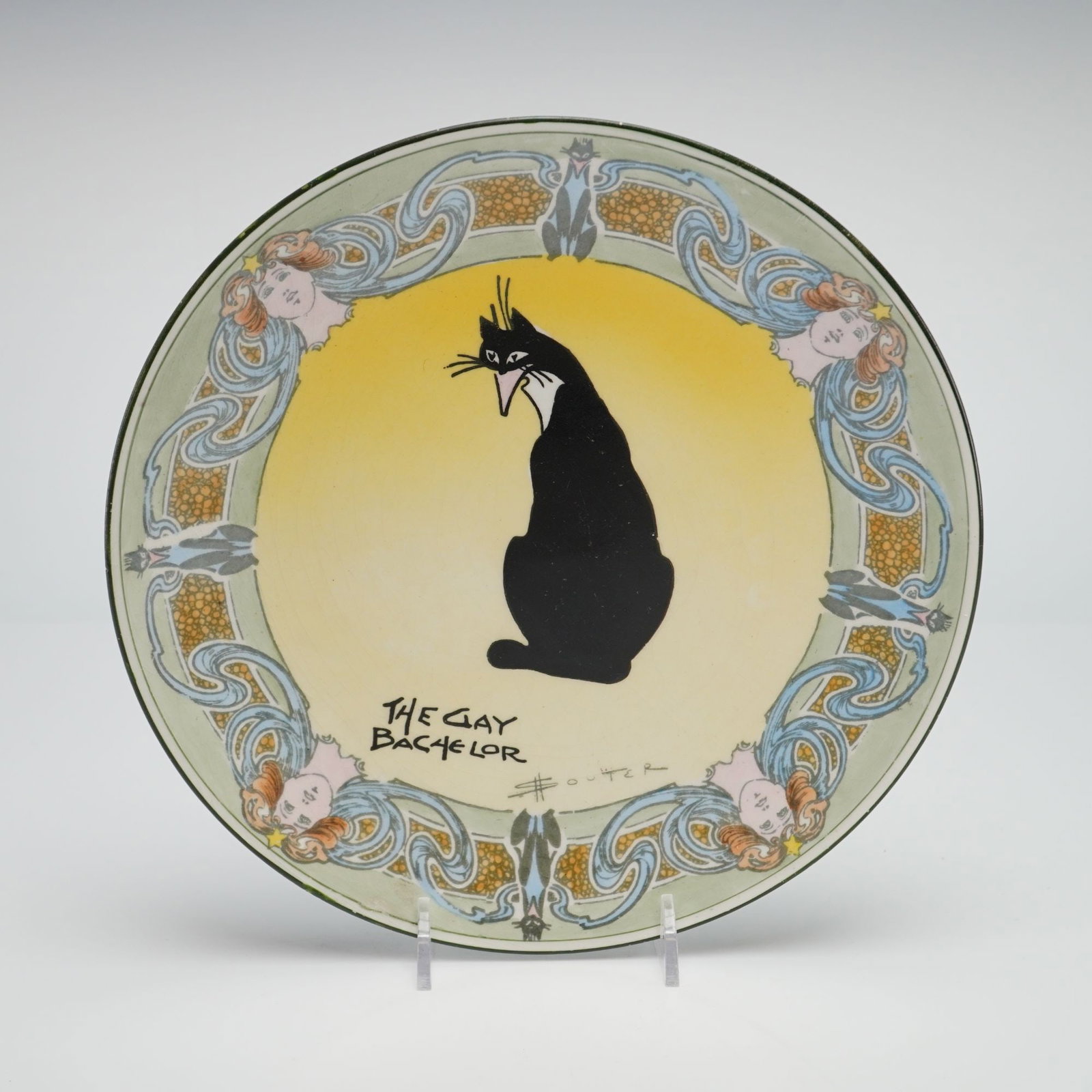 Royal Doulton by David Henry Souter Kateroo Series Ware Plate, The Gay Bachelor: This earthenware plate is part of the Royal Doulton Series Ware collection featuring designs by Australian artist David Henry Souter. The central motif, titled The Gay Bachelor, depicts a stylized bla