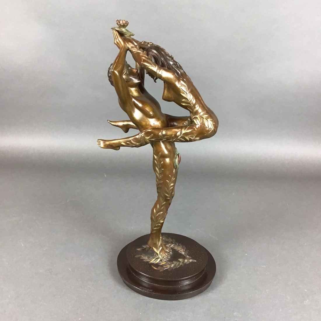 Amants, An After Erte (Romain de Tirtoff) Bronze Sculpture on Marble Base, Signed: This patinated bronze sculpture, titled Amants, is by Romain de Tirtoff, professionally known as Erte. The composition features a male and female figure in an intertwined pose with their limbs and low