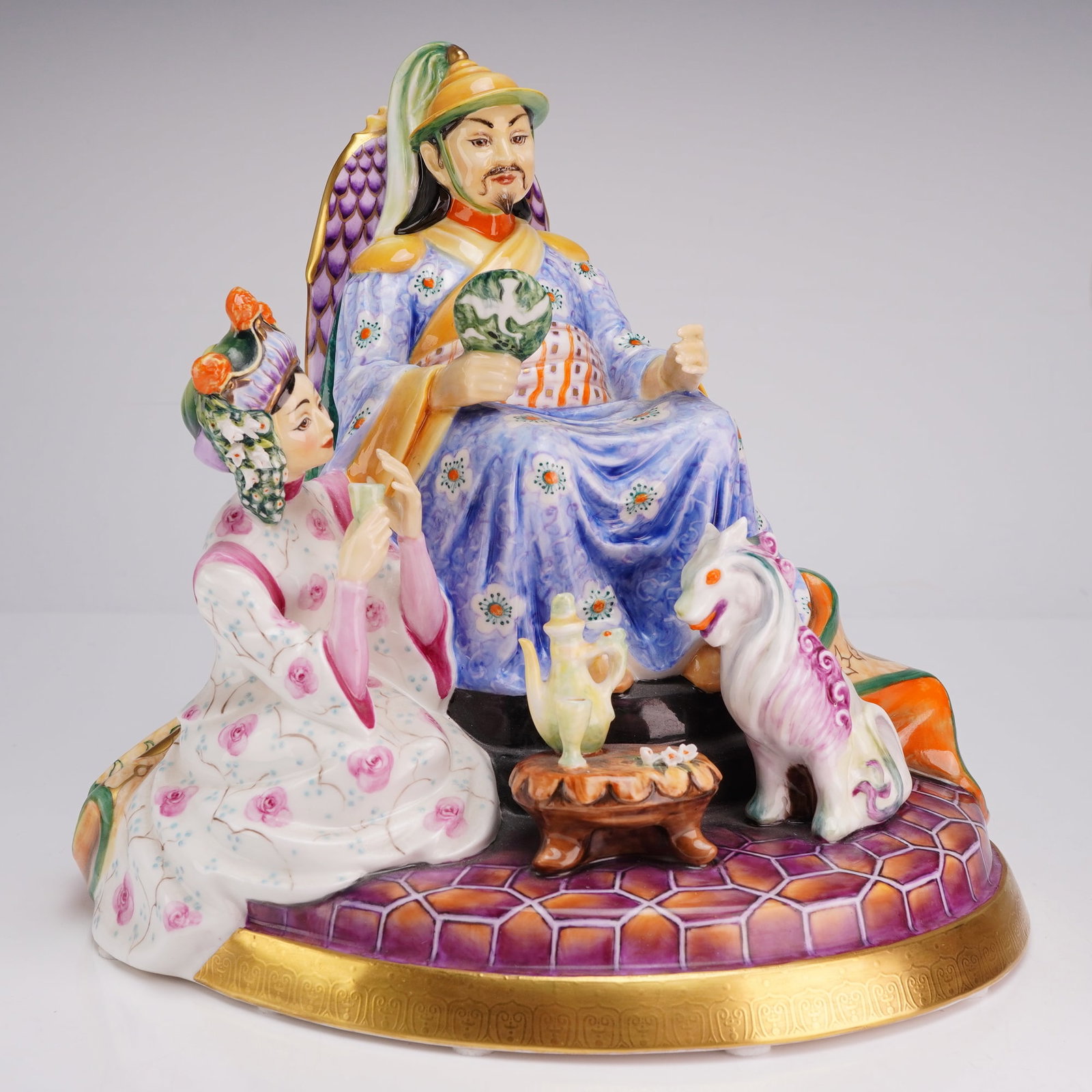 Peggy Davies The Kublai Khan Limited Edition Bone China Ceramic Sculpture: This large-scale bone china sculpture, titled The Kublai Khan, was designed by Peggy Davies and produced in England. The central figure represents the Mongol ruler seated on an ornate high-backed thro