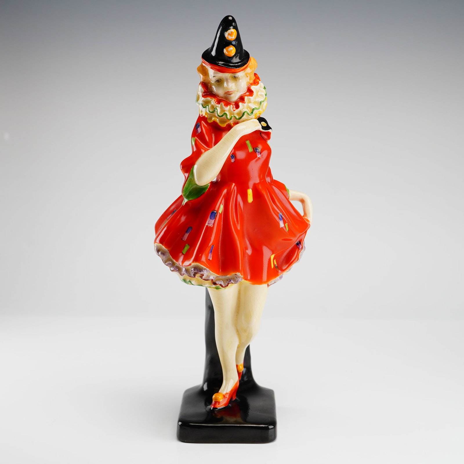 Royal Doulton Figurine Pierrette HN1391: This rare early Royal Doulton figurine titled Pierrette, model number HN1391, was designed by the celebrated artist Leslie Harradine and produced between 1930 and 1938. The Art Deco era piece features