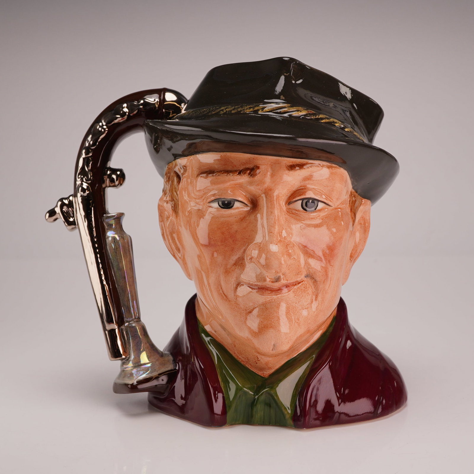 Royal Doulton Prototype Colorway Large Character Jug, The Antique Dealer: This Royal Doulton large character jug is modeled in The Antique Dealer pattern. The piece is crafted from glazed ceramic with hand-painted polychrome decoration. The subject is an 18th-century style 