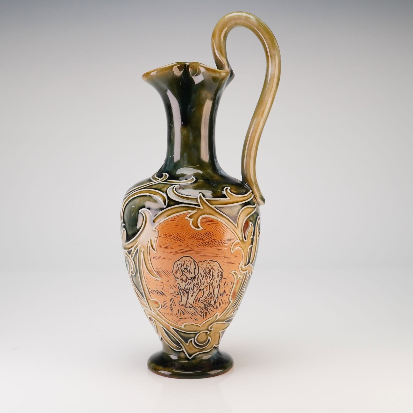 Royal Doulton by Hannah Barlow Stoneware Dog Motif Ewer: Hannah Barlow was a leading artist at Doulton's Lambeth studio and its first female employee, known for her incised (sgraffito) decoration depicting animals such as horses, cattle, and wildlife, creat
