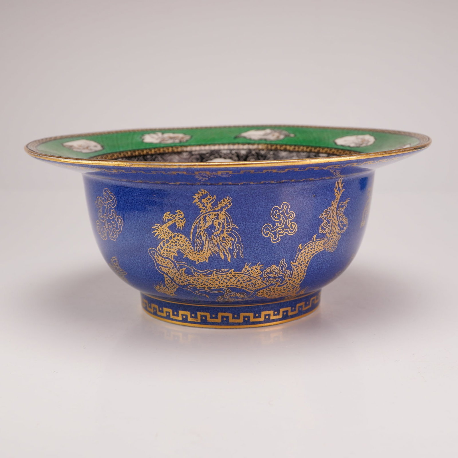 Wedgwood Powder Blue and Gilt Celestial Dragon Lustre Bowl: This Wedgwood porcelain bowl, a notable example of a Celestial Dragon ww bowl, is decorated in the Chinoiserie and Japonisme styles prevalent in the early 20th century. The exterior features a cobalt 