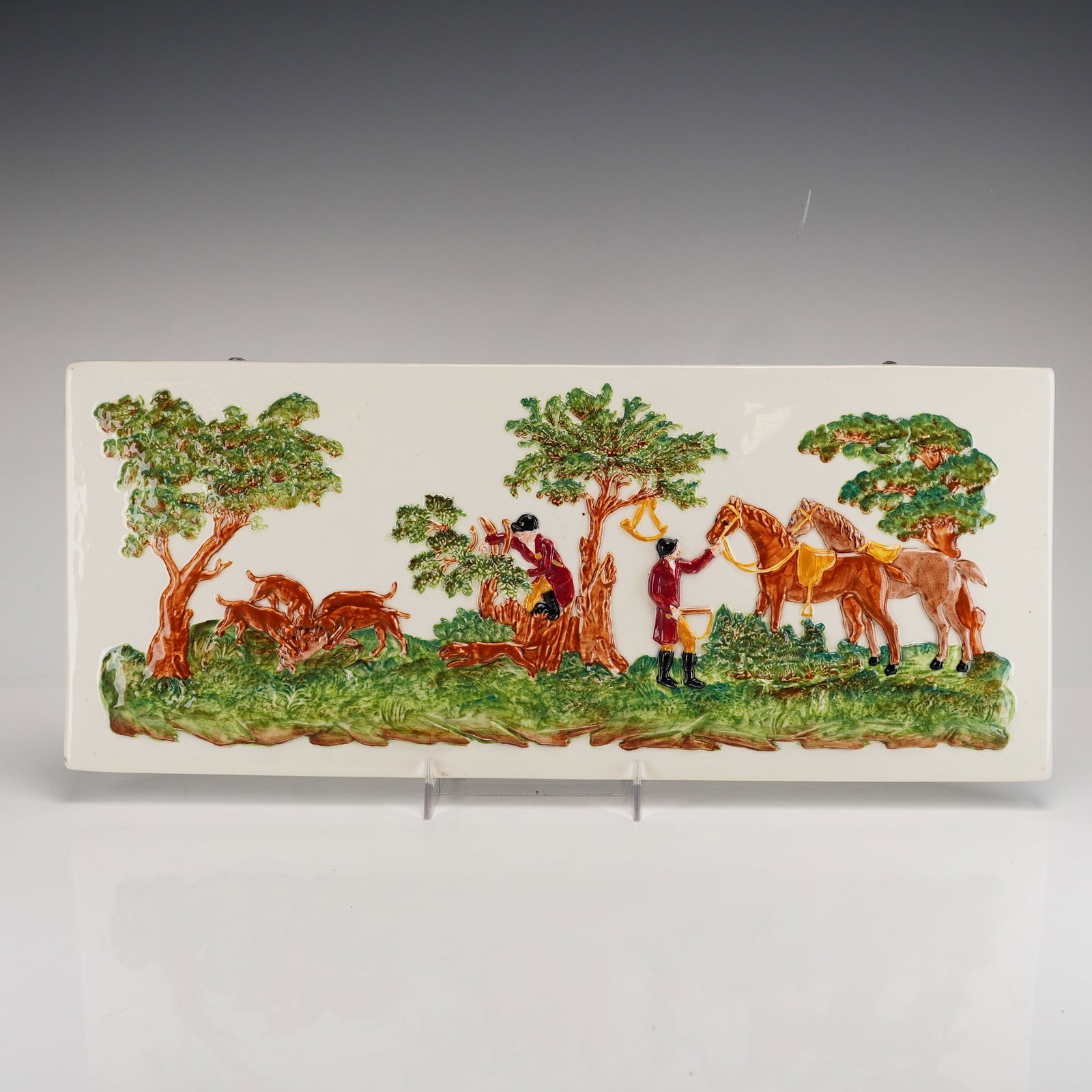 Wedgwood Majolica Fox Hunt Relief Plaque from The Rubin Collection: This rectangular ceramic relief plaque is manufactured by Wedgwood, as evidenced by the impressed WEDGWOOD mark on the reverse. The piece is an example of English Majolica, constructed from earthenwar