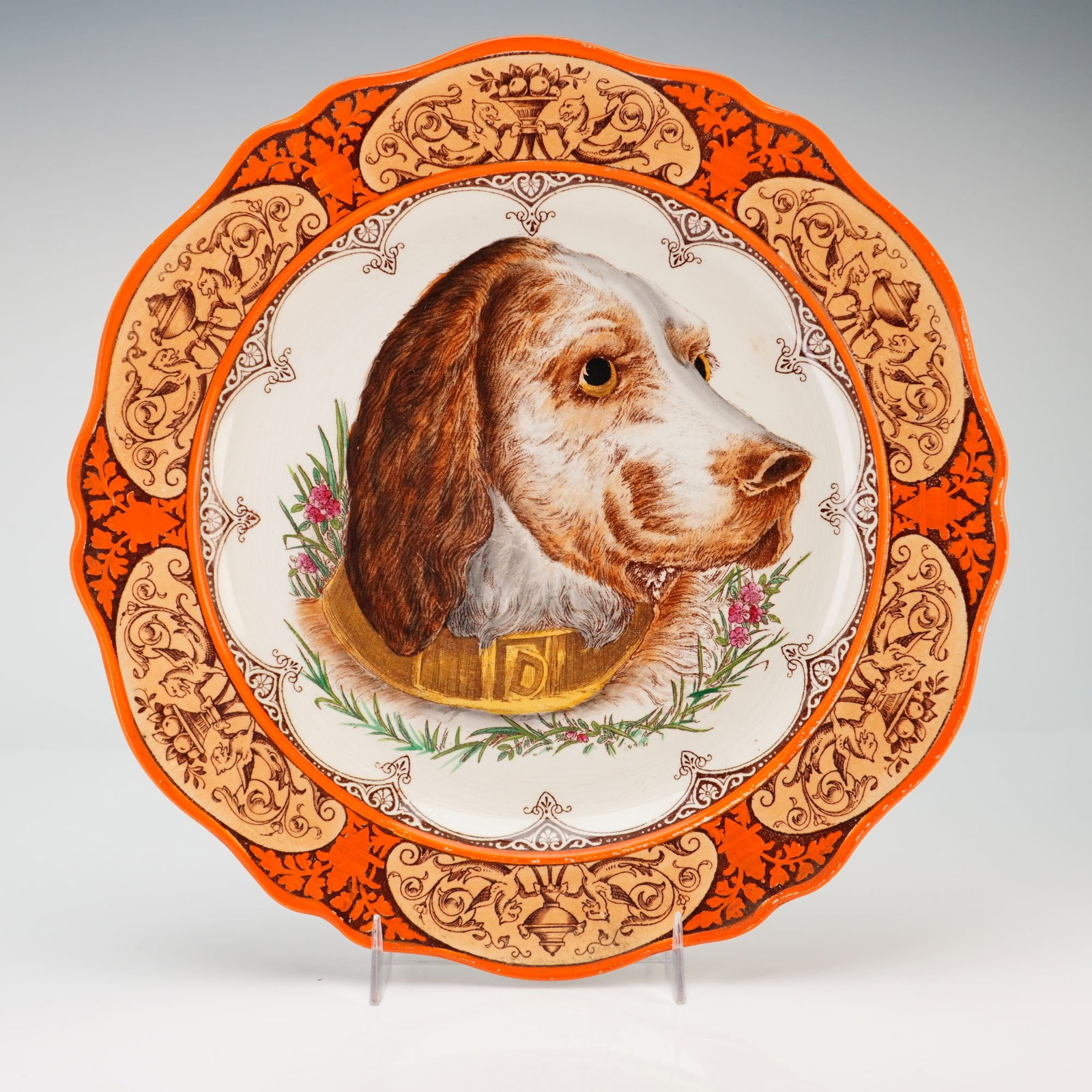 Wedgwood Etruria Dog Portrait Cabinet Plate from the Rubin Collection: This Wedgwood glazed earthenware cabinet plate features a central portrait of a brown and white sporting dog, possibly a setter, wearing a gold-colored collar embossed with the letter N. The portrait 