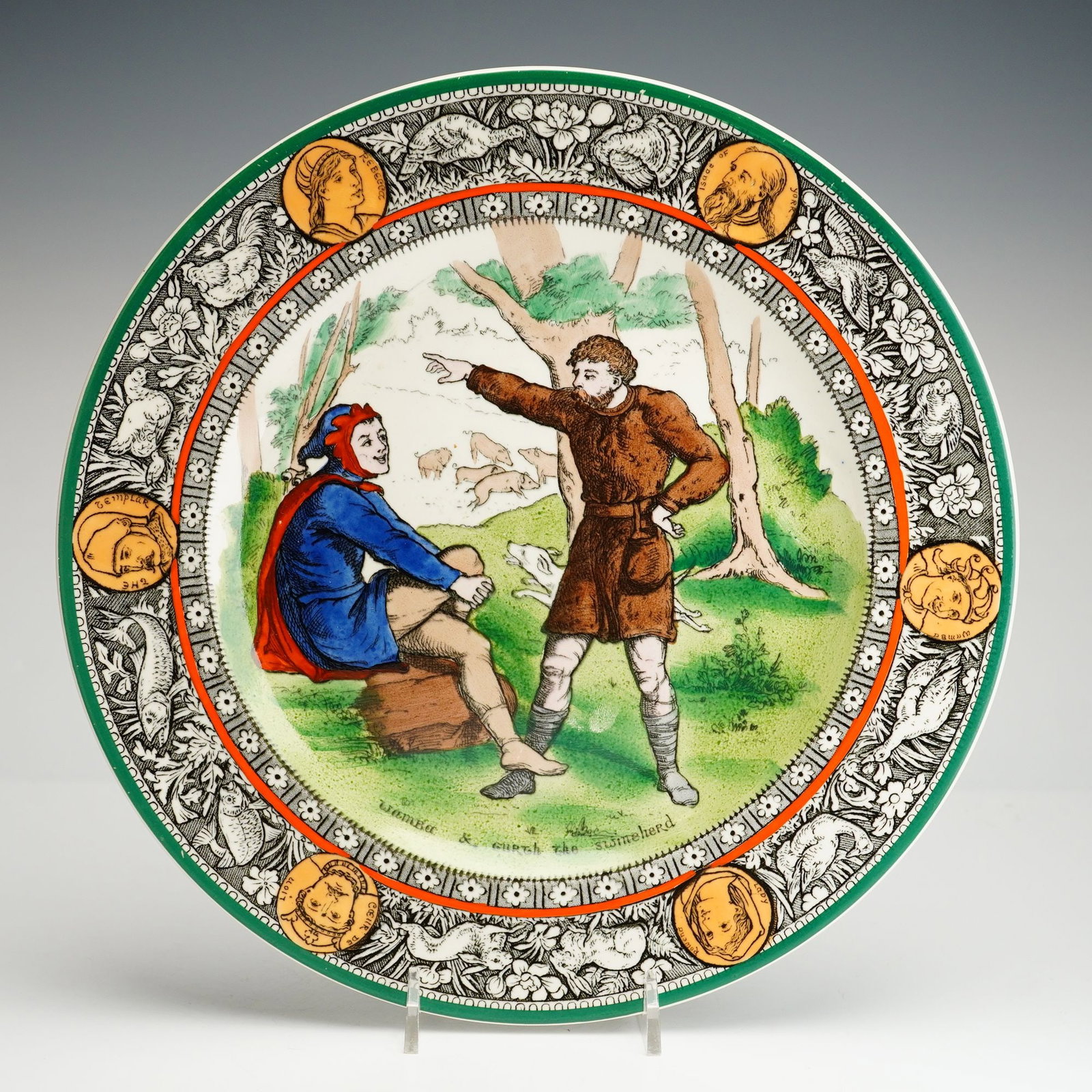 Wedgwood Etruria Ivanhoe Seriesware Plate, Wamba & Gurth the Swineherd: Based on Walter Scott's 1819 English novel, Ivanhoe, this earthenware plate features a detailed forest scene with Gurth the swineherd conversing with Wamba the jester. The decorative border showcases 