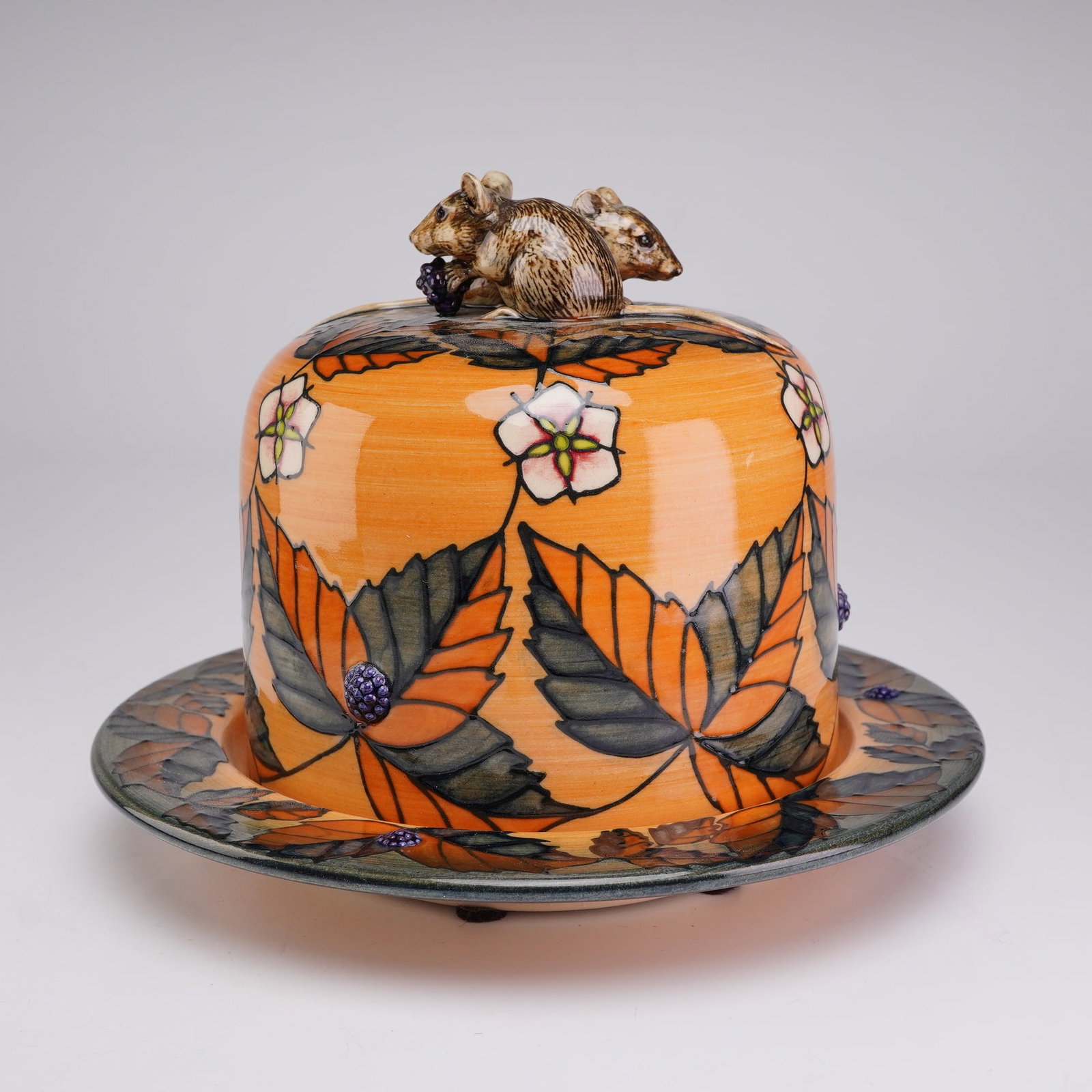 Dennis Chinaworks Limited Edition Pascoe Anniversary Domed Cheese Dish: Limited edition earthenware domed cheese or butter dish and matching underplate, commissioned to commemorate the 40th anniversary of Pascoe and Company. The set features a vibrant orange ground decora