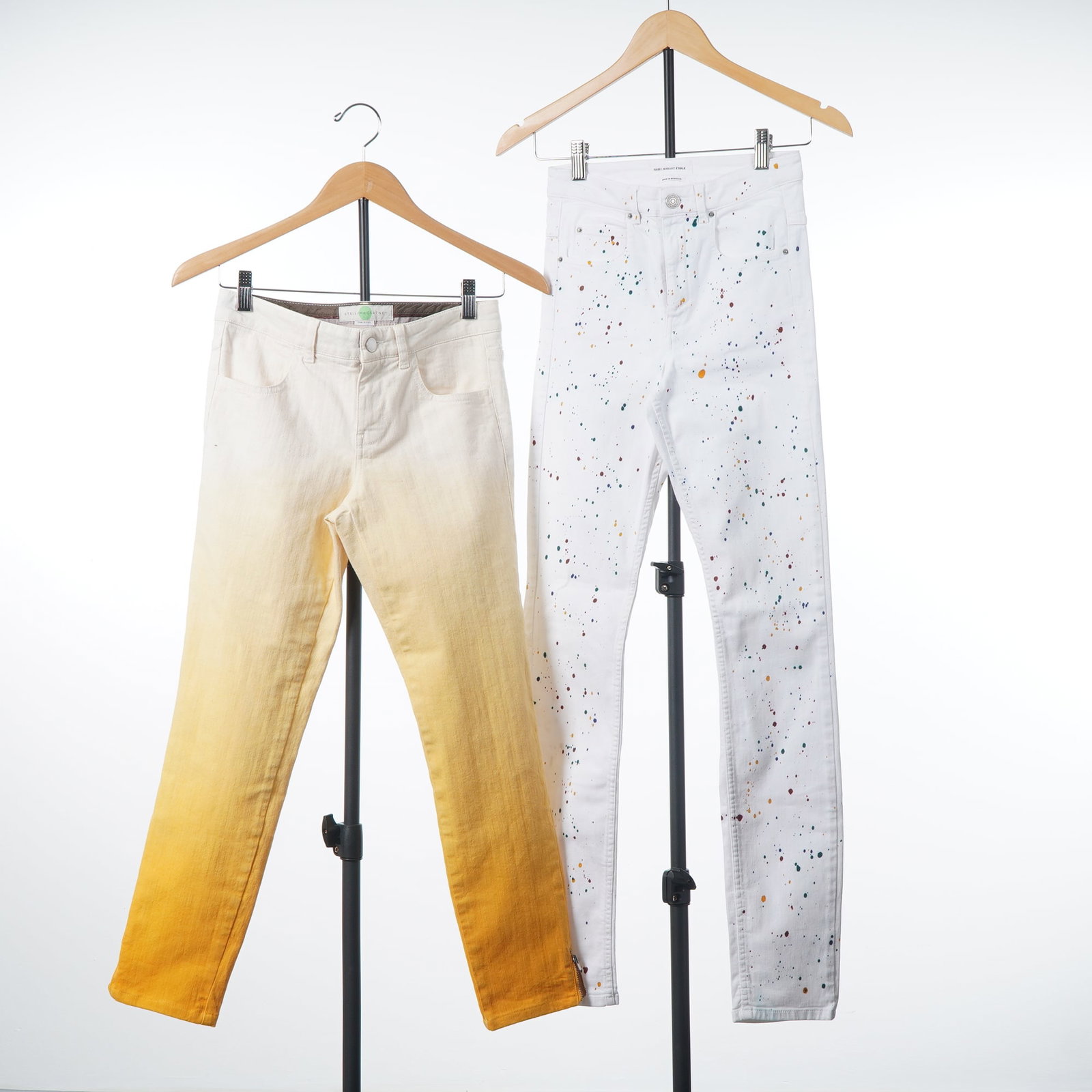 2pc Designer Jeans Including Stella McCartney and Isabel Marant Etoile: This lot features two pairs of designer pants. The first pair is by Stella McCartney, size 26, designed as five-pocket jeans in a fine-wale corduroy fabric. The colorway features a graduated ombre eff