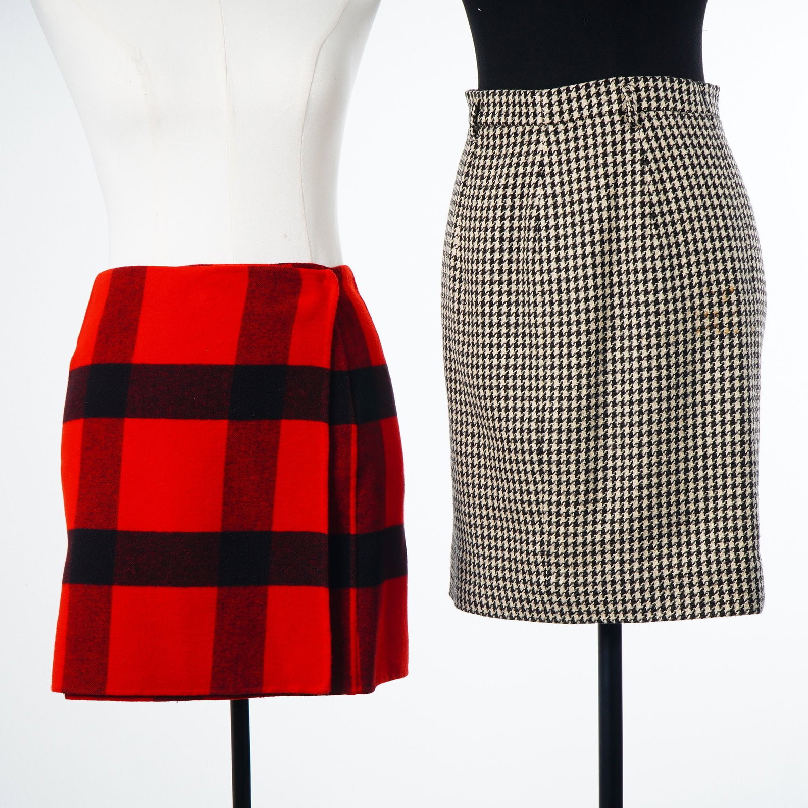 2pc Designer Skirts including Ralph Lauren Collection and Jil Sander: Two designer skirts including a Ralph Lauren Collection buffalo check wrap skirt and a Jil Sander houndstooth pencil skirt. The Ralph Lauren Collection skirt is a wrap-style mini skirt featuring a red