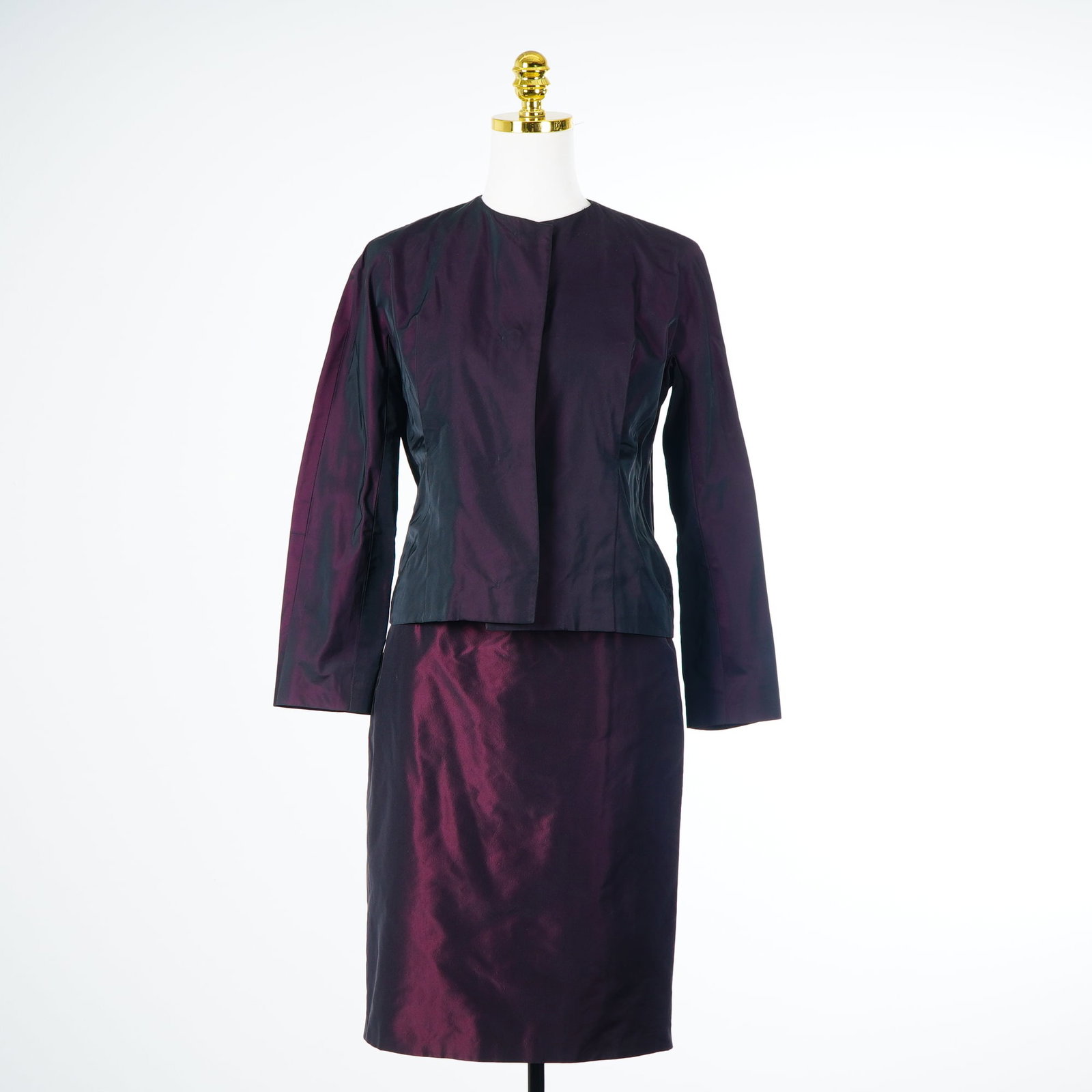 2pc Ensemble of Jil Sander Shirt and a Rickie Freeman for Teri Jon Skirt: This matched two-piece ensemble consists of a Jil Sander shirt and a Rickie Freeman for Teri Jon skirt, both rendered in a coordinated iridescent plum taffeta-style fabric. The Jil Sander top is a col
