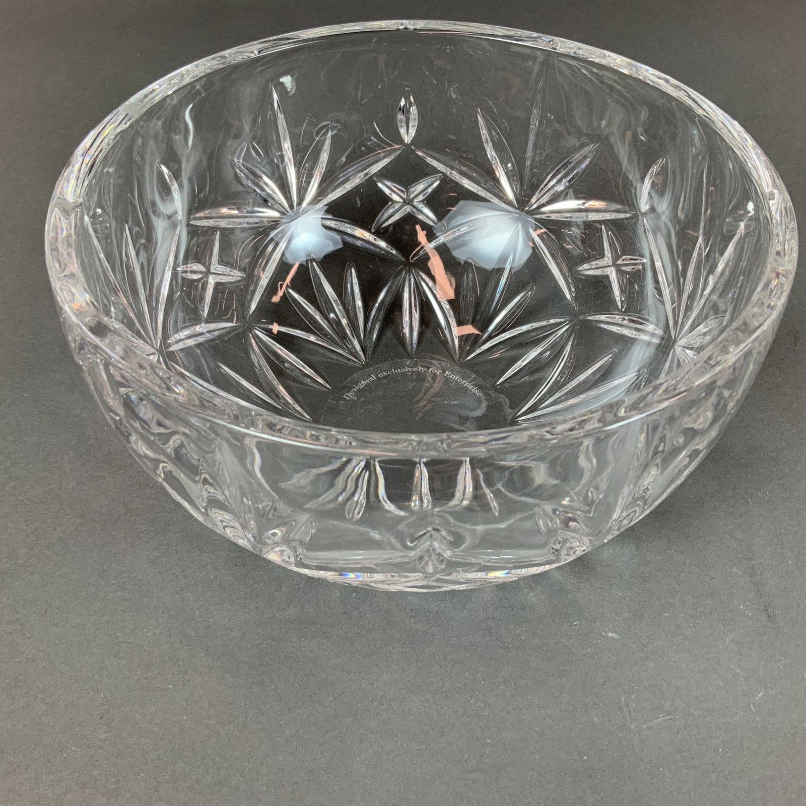 Tiffany & Co. Sybil Pattern Cut Crystal Bowl Designed Exclusively for Enterprise: This Tiffany & Co. glass bowl is crafted from clear lead crystal in the Sybil pattern. Produced as an exclusive commission for Enterprise, the circular bowl features a deep-cut geometric design. The o