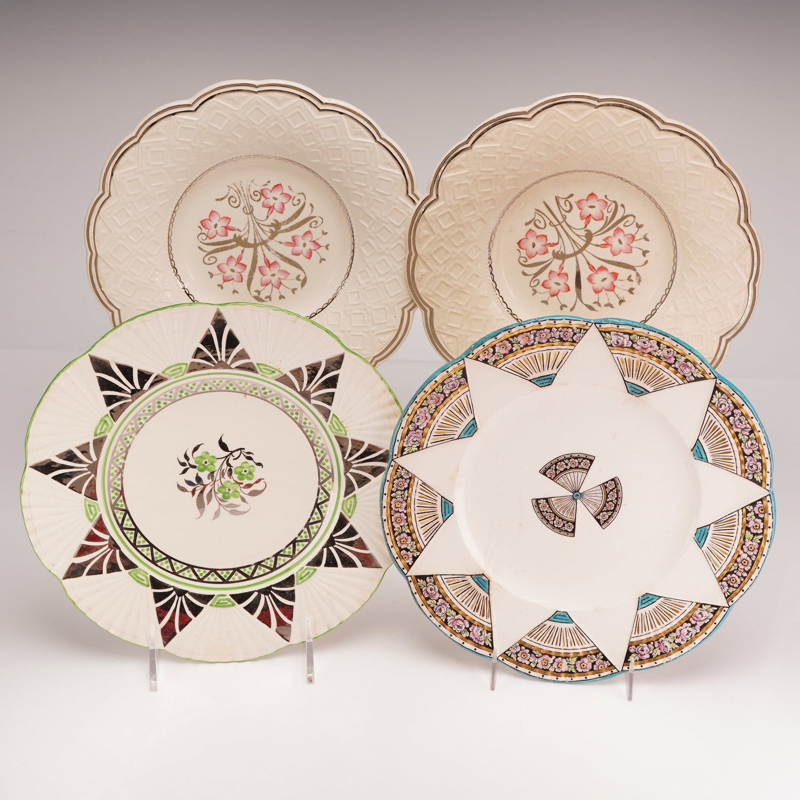4pc Wedgwood Earthenware Plates: This set of four glazed earthenware creamware plates was produced by Wedgwood at the Etruria factory in England. The collection, which includes pieces marked with the Rubin Collection inventory sticke