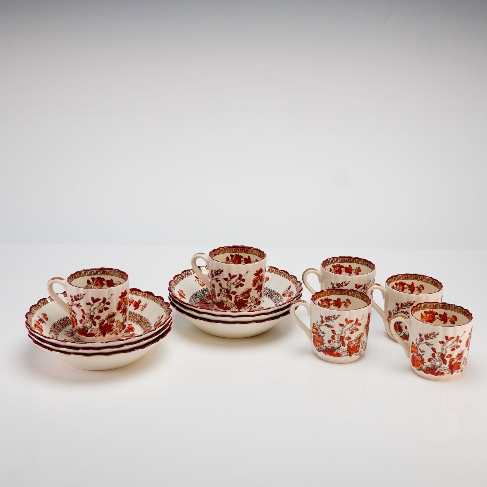 Copeland Spode India Tree 12pc Flat Cup and Bowl Grouping: This 12pc Copeland Spode England India Tree grouping includes six flat cups and six fruit/dessert/sauce bowls. Produced in England, the set is crafted from fine earthenware ironstone featuring the flu