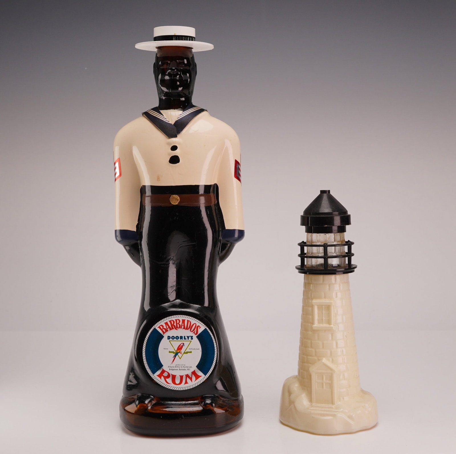 Two Branded Bottles Including Doorly's Barbados Rum Harbour Police Decanter and Old Spice Lighthouse (1 of 3)