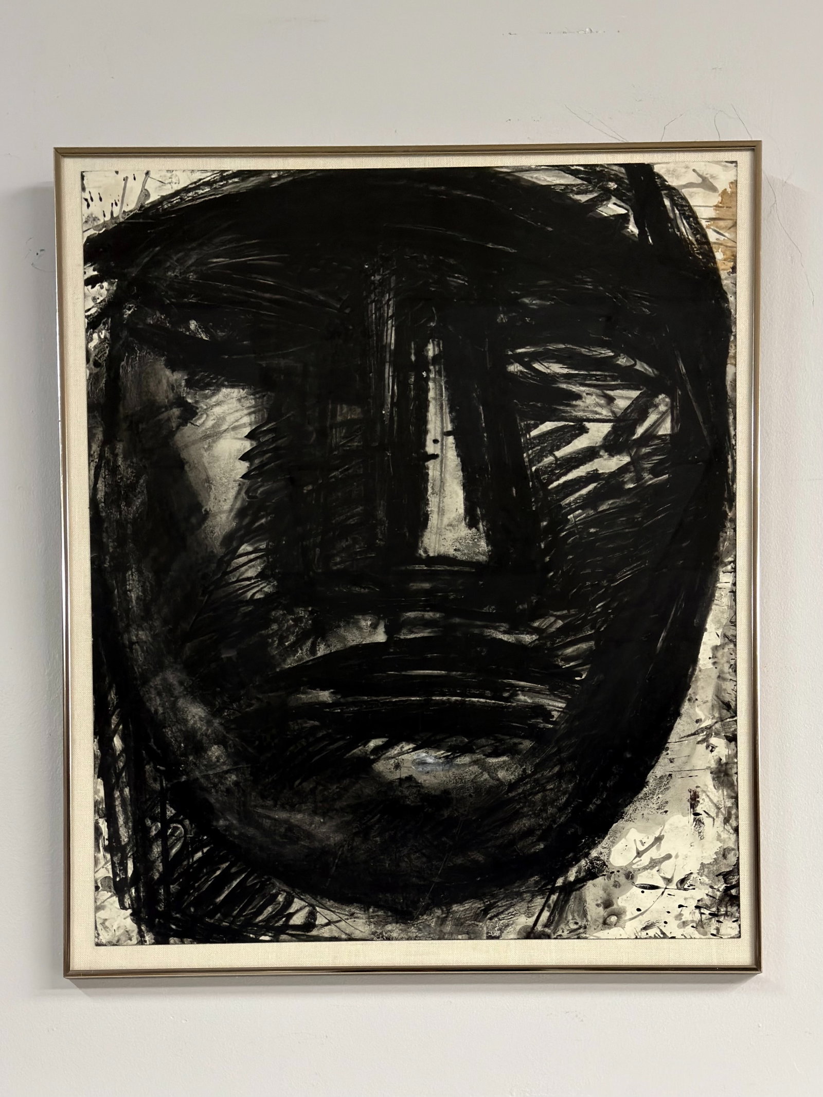 Sylvia Schuster (American, b. 1943) Mixed Media Painting on Paper, Abstracted Portrait: This portrait drawing on paper by the American artist Sylvia Schuster. Executed in charcoal, ink, and pastel, the work depicts a stylized, monolithic human face in a Neo-Expressionist style. The compo