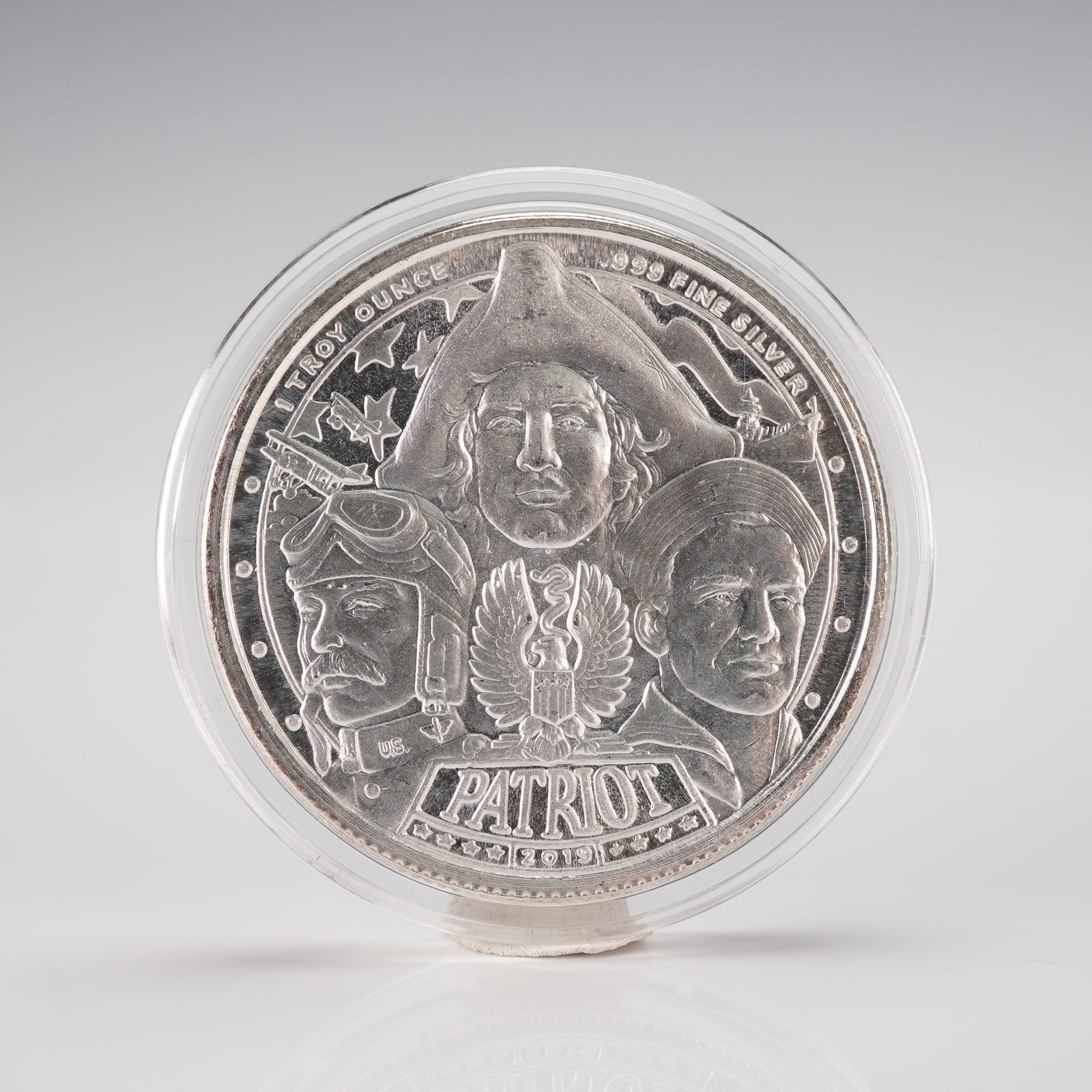 2019-M Don't Tread on Me Patriot Silver Bullion: his one troy ounce .999 fine silver round features an obverse design depicting three stylized American patriots representing different eras of U.S. military service, along with an American eagle emble