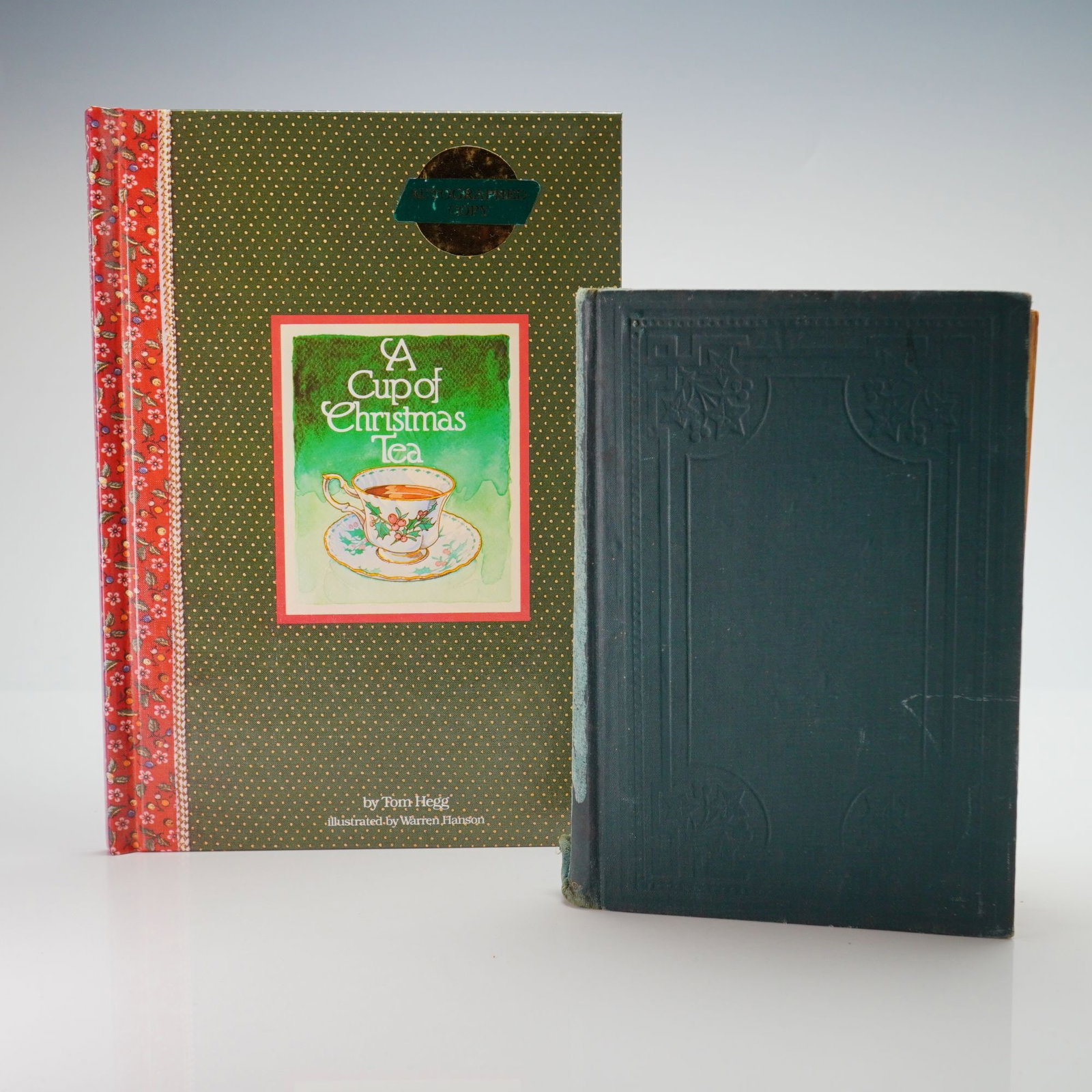 Two Books including Hegg, Tom. A Cup of Christmas Tea. Waldman House Press, 1982. (Signed) (1 of 4)