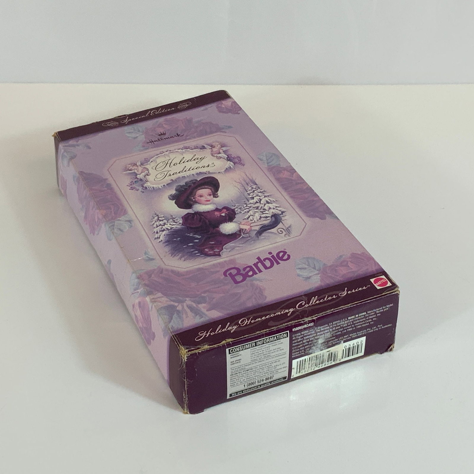 1996 Special Edition Holiday Traditions Barbie Doll Hallmark Holiday Homecoming Collector Series: This 1996 Special Edition Holiday Traditions Barbie doll is the first release in the Holiday Homecoming Collector Series produced by Mattel for Hallmark. The vinyl doll is dressed in an early