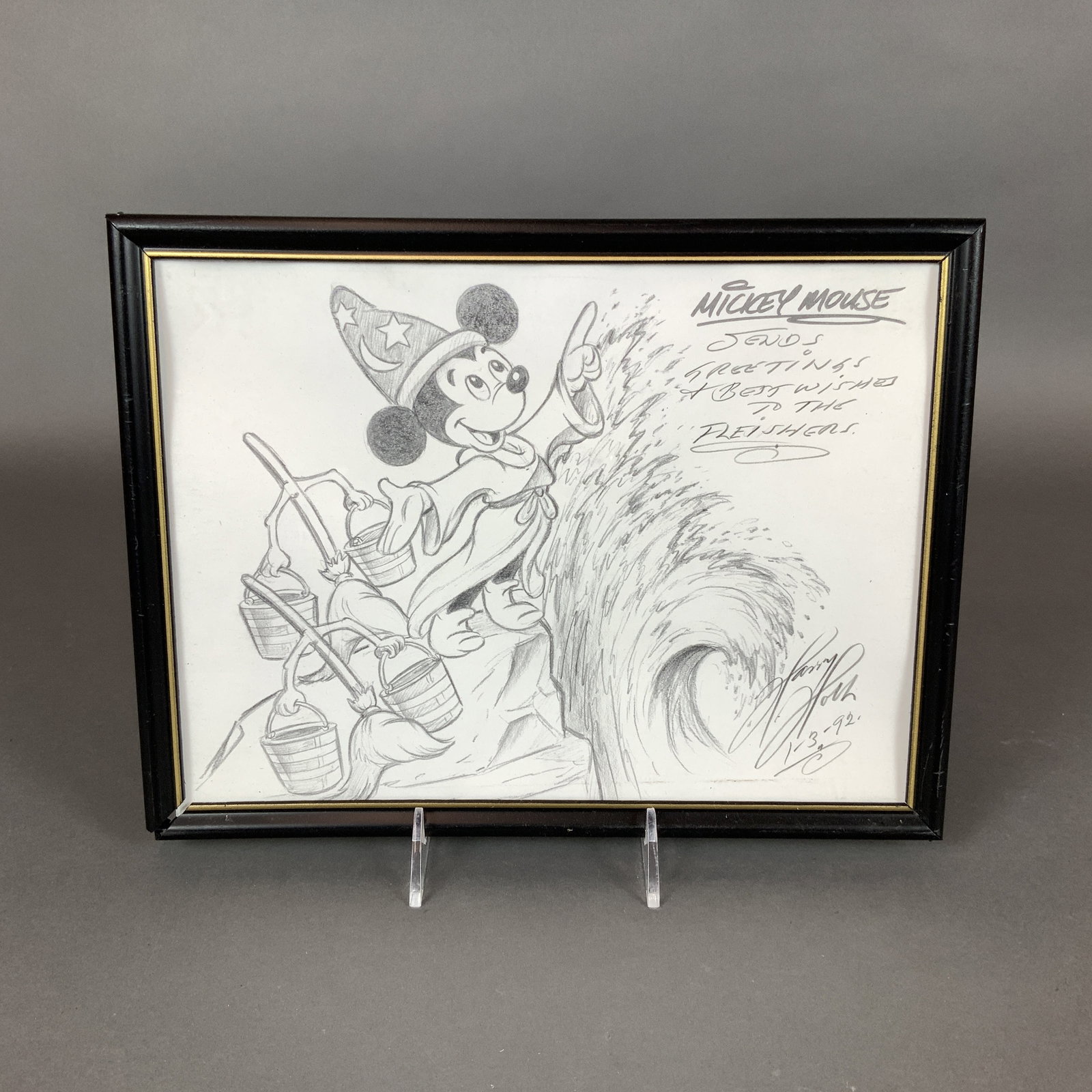 Harry Holt Signed Mickey Mouse Sorcerer's Apprentice Sketch Print: This framed print of a sketch by Disney animator Harry Holt depicts Mickey Mouse as the Sorcerer's Apprentice from the 1940 animated feature Fantasia. Mickey is shown in his iconic robes and pointed h