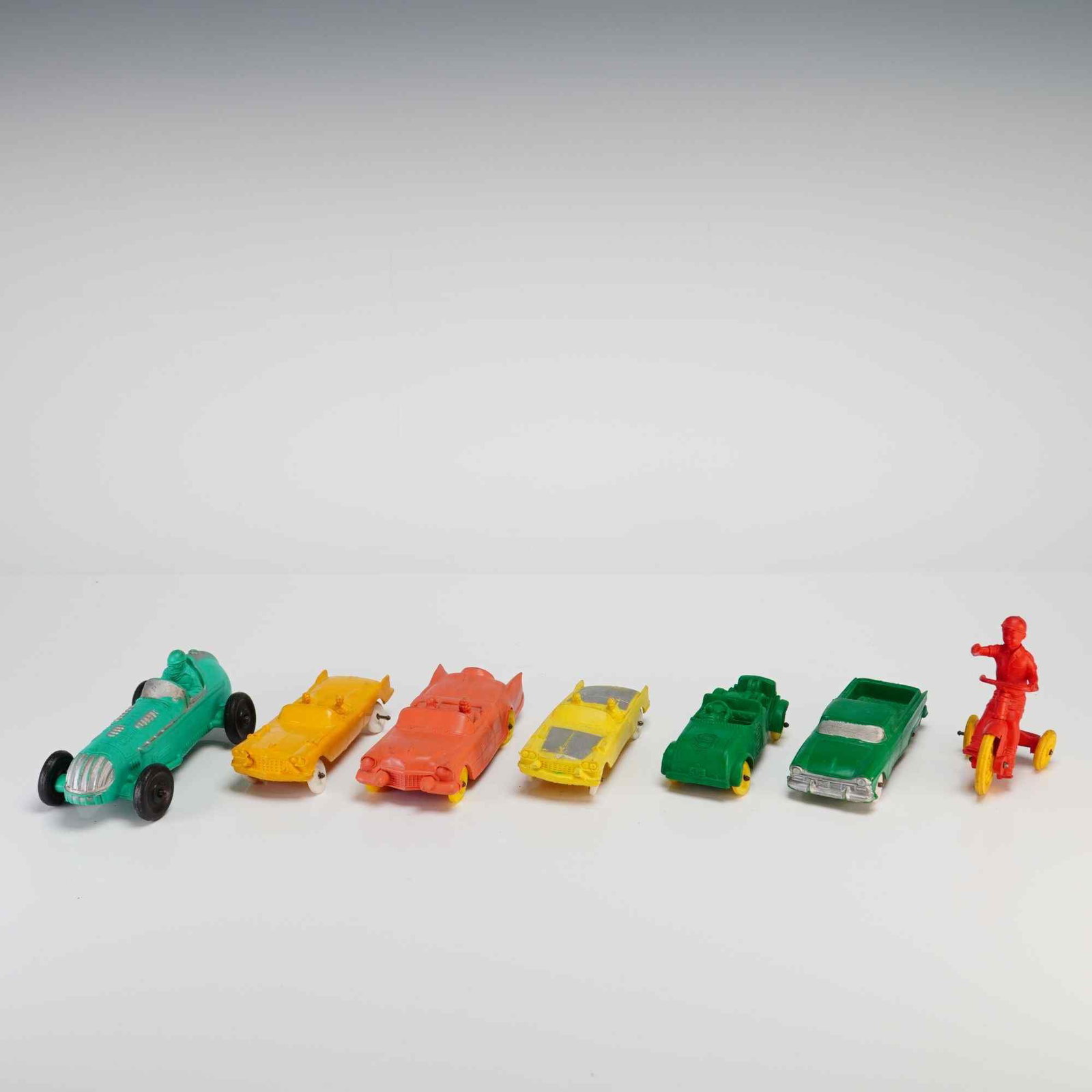 7pc Collection of Auburn Toy Cars and Vehicles: This collection of toy cars and vehicles was manufactured by Renwal in the United States. The assortment is constructed from hard molded plastic and features metal axles with plastic wheels in various