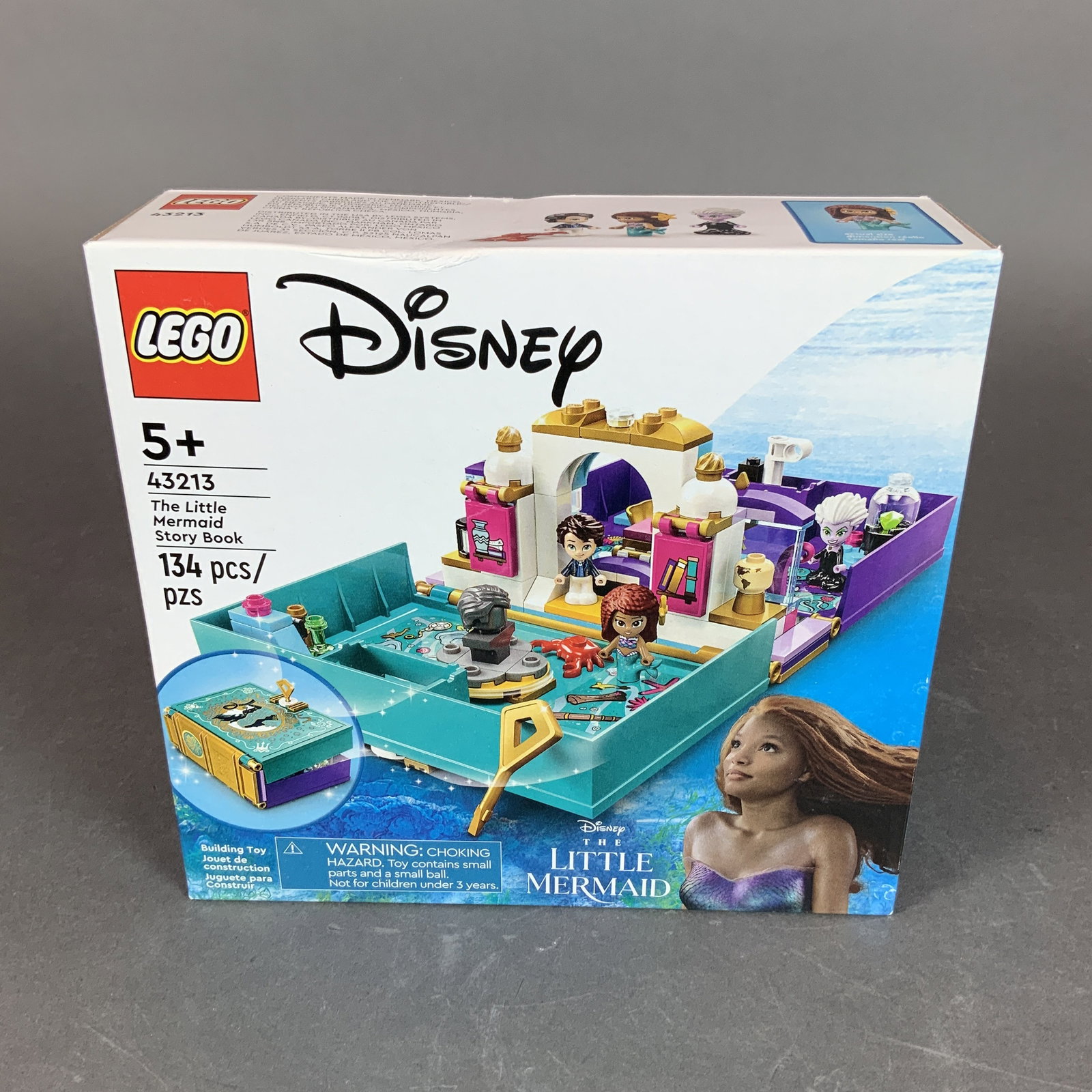 LEGO Disney The Little Mermaid Story Book 43213: LEGO Disney building set number 43213, The Little Mermaid Story Book, consisting of 134 plastic pieces. This set features a portable, lockable book that opens to reveal a three-section play environmen