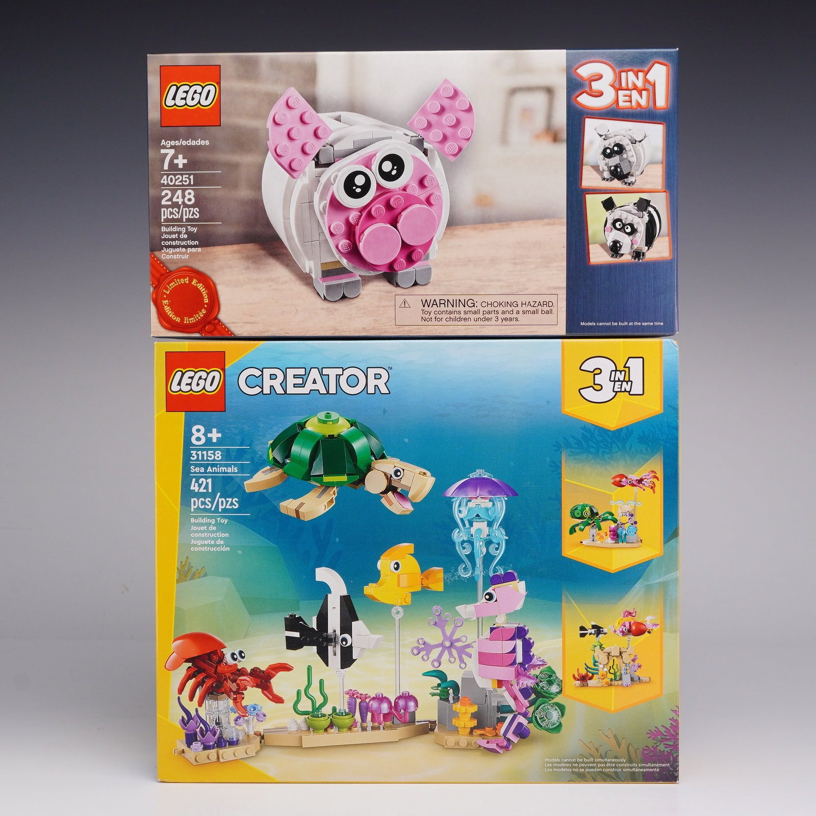 2pc LEGO 3-in-1 Construction Sets including 31158 Sea Animals and 40251 Mini Piggy Bank: This lot consists of two sets manufactured by the LEGO Group. The first item is LEGO set 40251 Mini Piggy Bank, which utilizes a 3-in-1 building system allowing the user to create a pig, a panda, or a