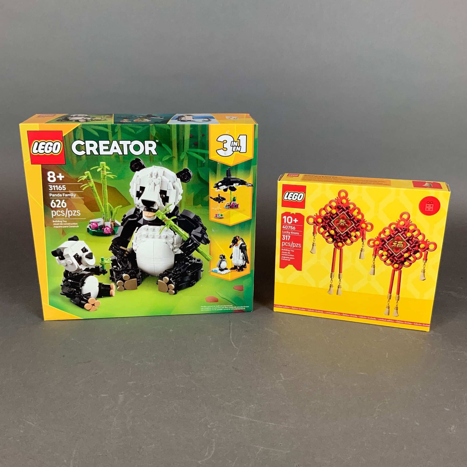 2pc LEGO Building Sets Creator Panda Family 31165 and Lucky Knots 40756: This lot consists of two original LEGO building sets, both in their factory-sealed retail packaging. The first set is the LEGO Creator 3-in-1 Wild Animals: Panda Family (Set 31165), which contains 626