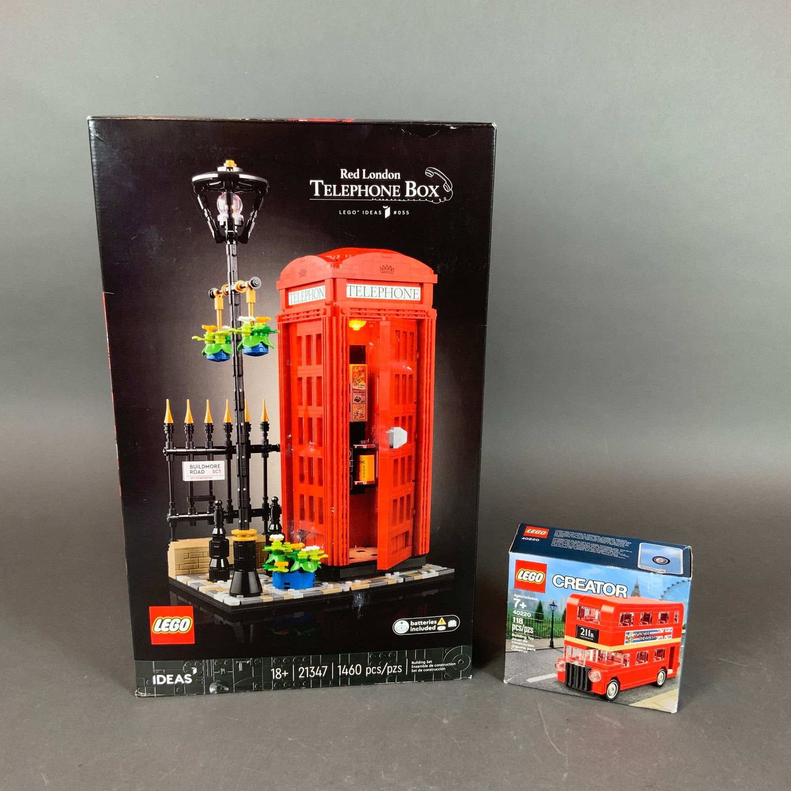 2pc LEGO London-Themed Construction Sets 21347 and 40220: This lot consists of two plastic construction sets manufactured by The LEGO Group, themed after iconic London landmarks. The first item is the LEGO Ideas Red London Telephone Box, set number 21347 (Id