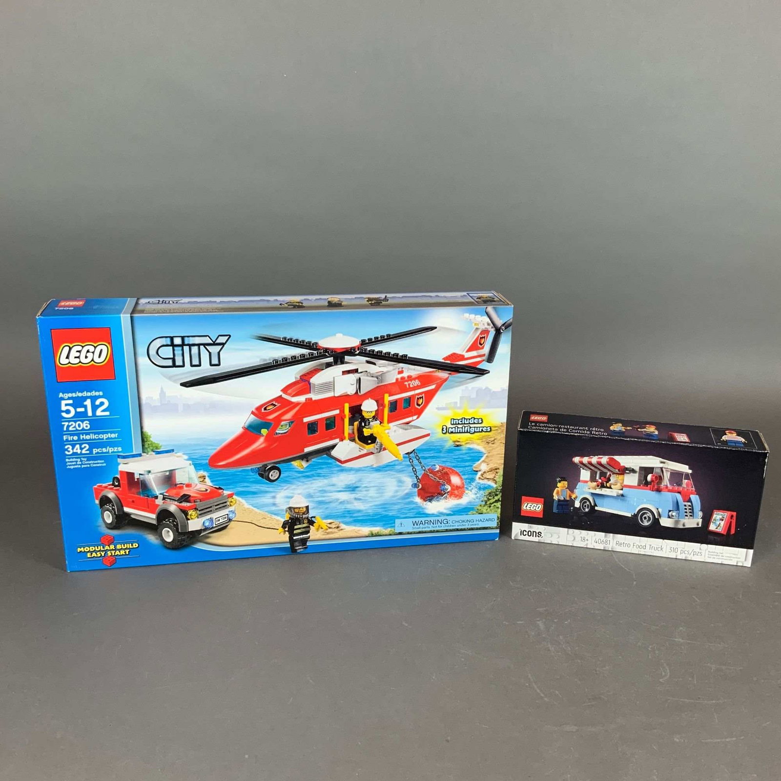 2pc LEGO Sets: City Fire Helicopter 7206 & Icons Retro Food Truck 40681: This lot features two factory-packaged LEGO construction sets composed of molded plastic components. The first set is the LEGO City Fire Helicopter, set number 7206, which includes 342 pieces and thre