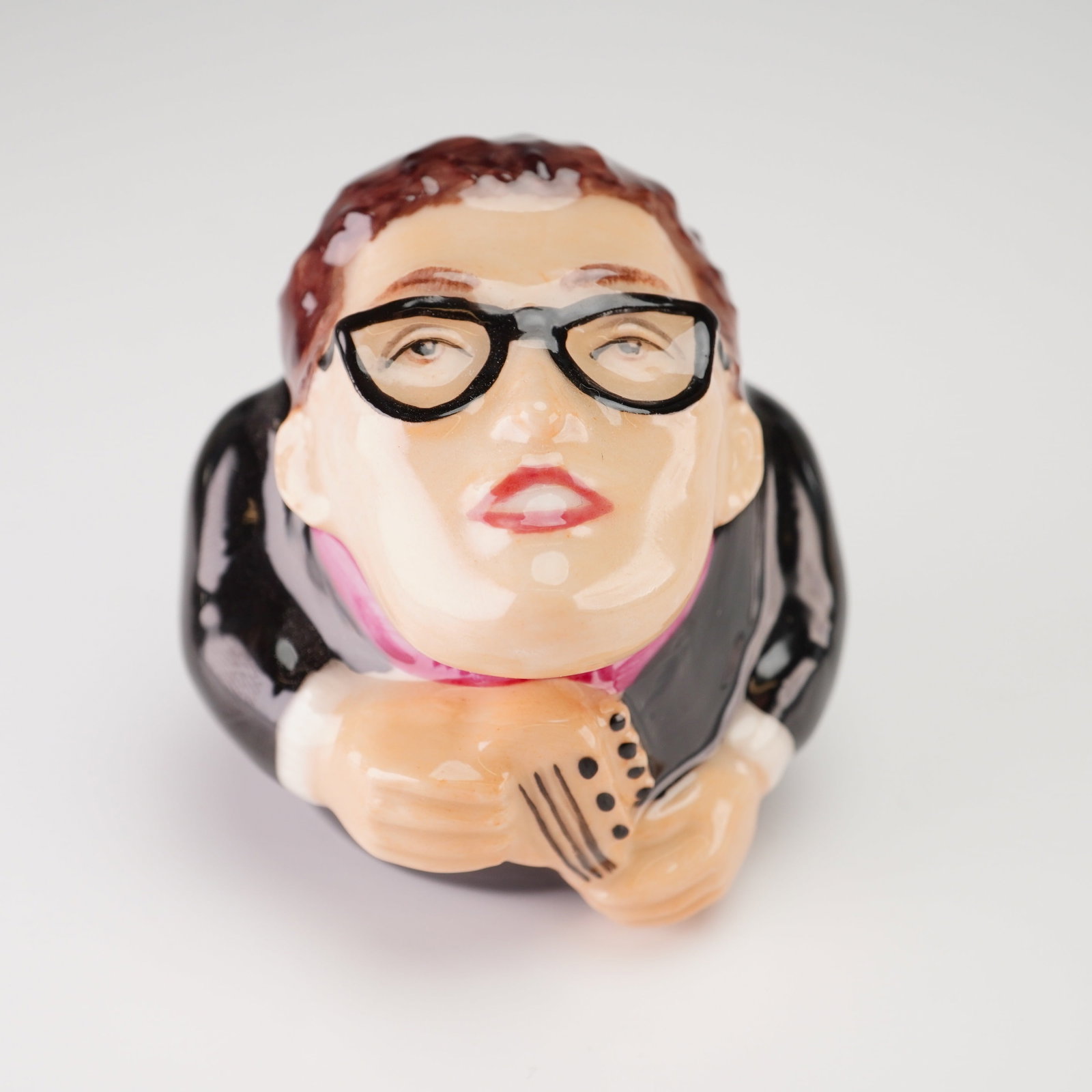 Kevin Francis Ceramic Face Pot, Buddy Holly: A Kevin Francis Buddy Holly Face Pot, produced in 2001. This lidded ceramic container is part of the Face Pot series and features a high-gloss glazed finish. The lid is sculpted as the head of the mus