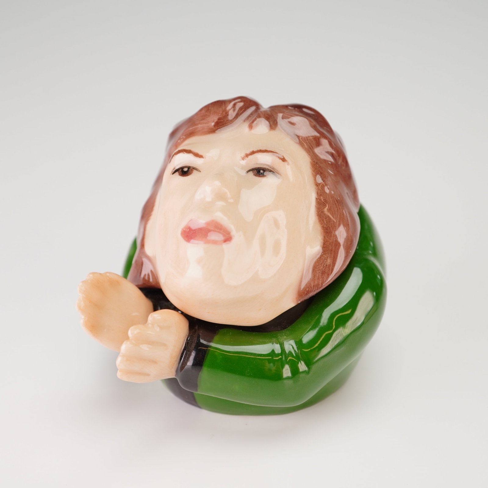 Kevin Francis Face Pot, Mick Jagger: A two-piece glazed ceramic Face Pot trinket box manufactured by Kevin Francis. This item is a caricature of Mick Jagger, featuring a removable lid in the form of the singer's head with brown hair and 