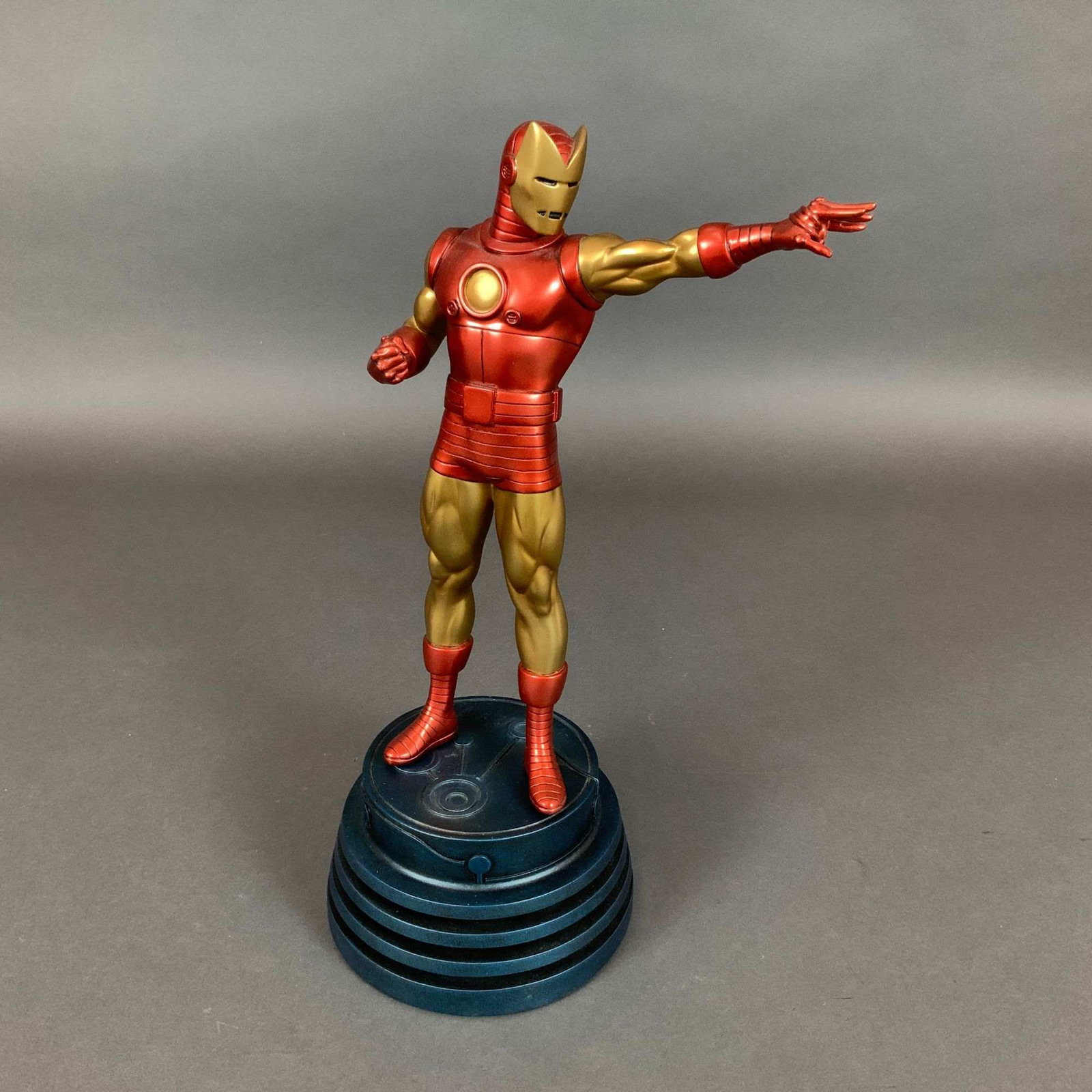Bowen Designs Marvel Retro Version Painted Statue, The Invincible Iron Man with Box: This is a collectible painted statue of the Marvel Comics character Iron Man, specifically the Retro Version featuring the Model 2 horned helmet armor design. The figure is constructed of cold-cast re