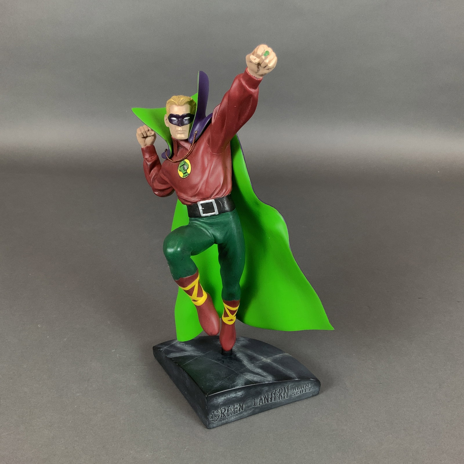 DC Direct Golden Age Green Lantern Alan Scott Limited Edition Cold-Cast Porcelain Statue: Produced by DC Direct, this limited edition cold-cast porcelain figurine features Alan Scott, the Golden Age Green Lantern. The hand-painted statue depicts the character in a flying pose, wearing his 
