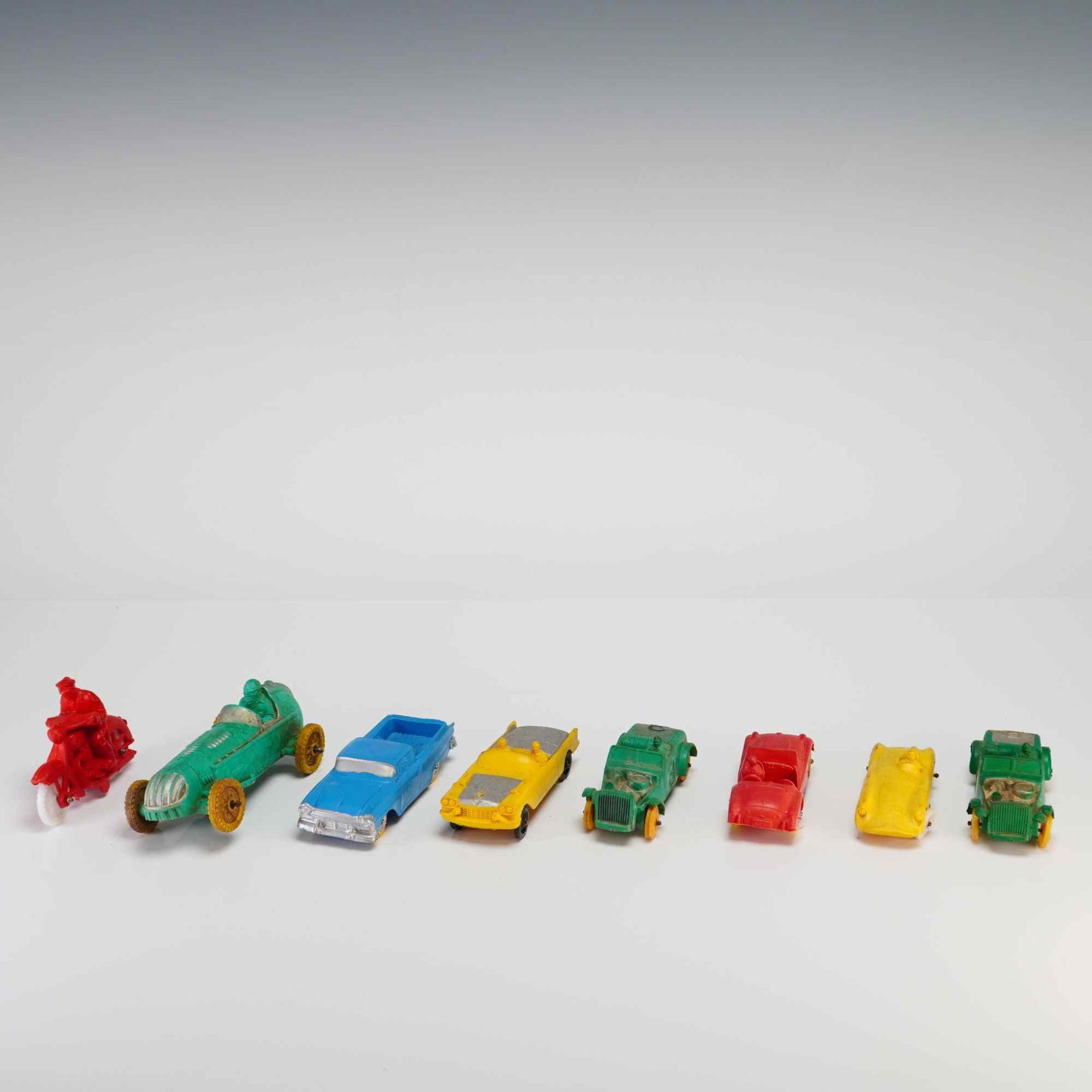 8pc Collection of Auburn Toy Cars and Vehicles: This collection of toy cars and vehicles was manufactured by Auburn Rubber in the United States. The assortment is constructed of molded plastic with metal axles and free-rolling wheels. Included in t