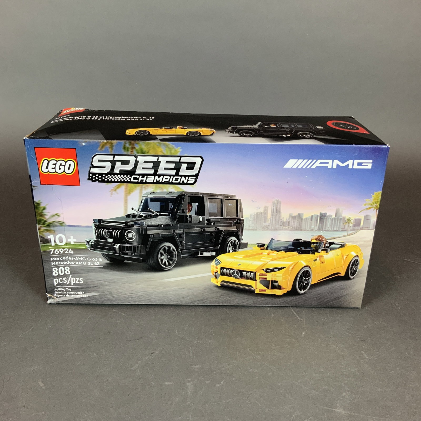 LEGO Speed Champions Set, Mercedes-AMG G 63 and Mercedes-AMG SL 63 76924: This LEGO Speed Champions building set, model number 76924, features two licensed Mercedes-AMG vehicles. The set is comprised of 808 plastic interlocking bricks used to construct a black Mercedes-AMG 