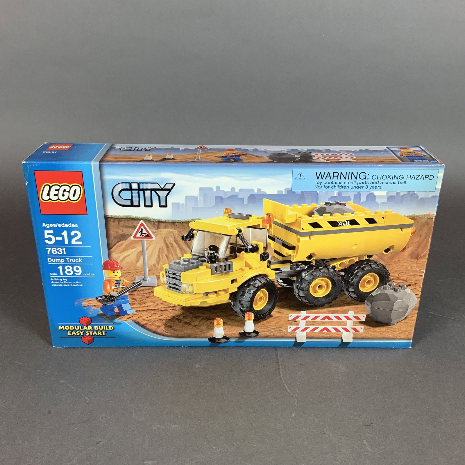 LEGO City Set, Dump Truck 7631: This LEGO City Dump Truck construction set, model number 7631, was manufactured by LEGO. The set is comprised of 189 molded plastic pieces used to build a heavy-duty construction vehicle. The main mod