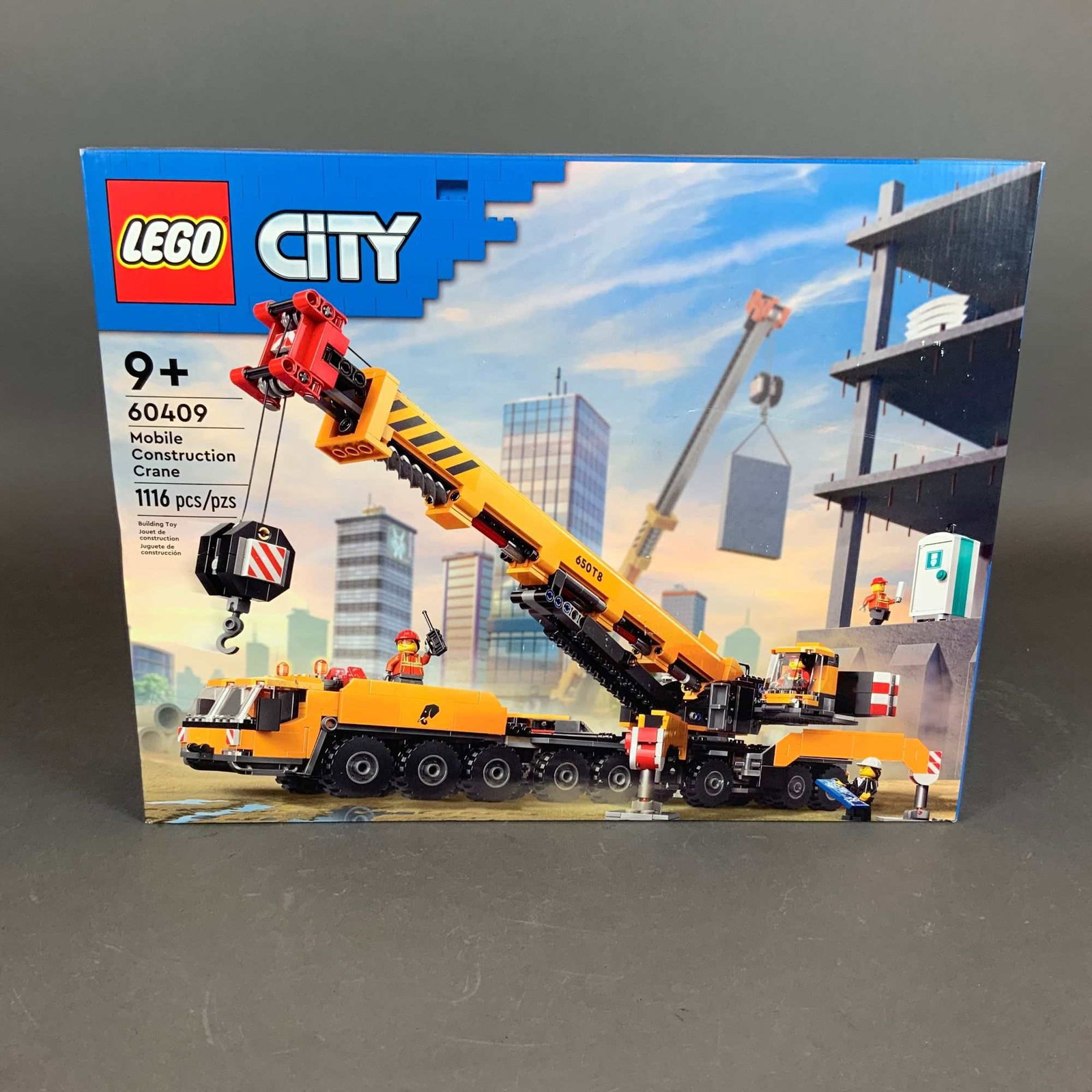LEGO City Set, Mobile Construction Crane 60409: LEGO City Mobile Construction Crane set, number 60409, manufactured by The LEGO Group. This plastic building set contains 1,116 pieces and is recommended for ages 9 and up. The model depicts a detaile