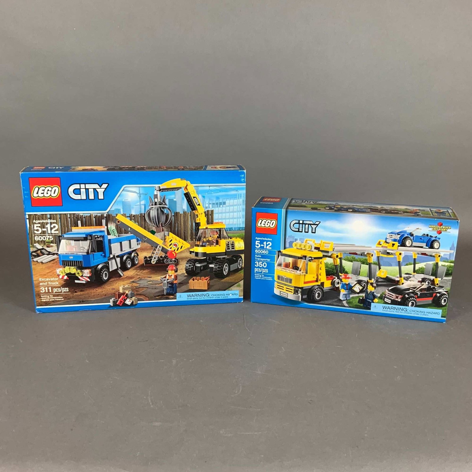2pc LEGO City Sets, Auto Transporter 60060, Excavator and Truck 60075: This lot consists of two building sets from the LEGO City line, both preserved in their original retail packaging. The first set is the Auto Transporter, set number 60060, which contains 350 plastic p