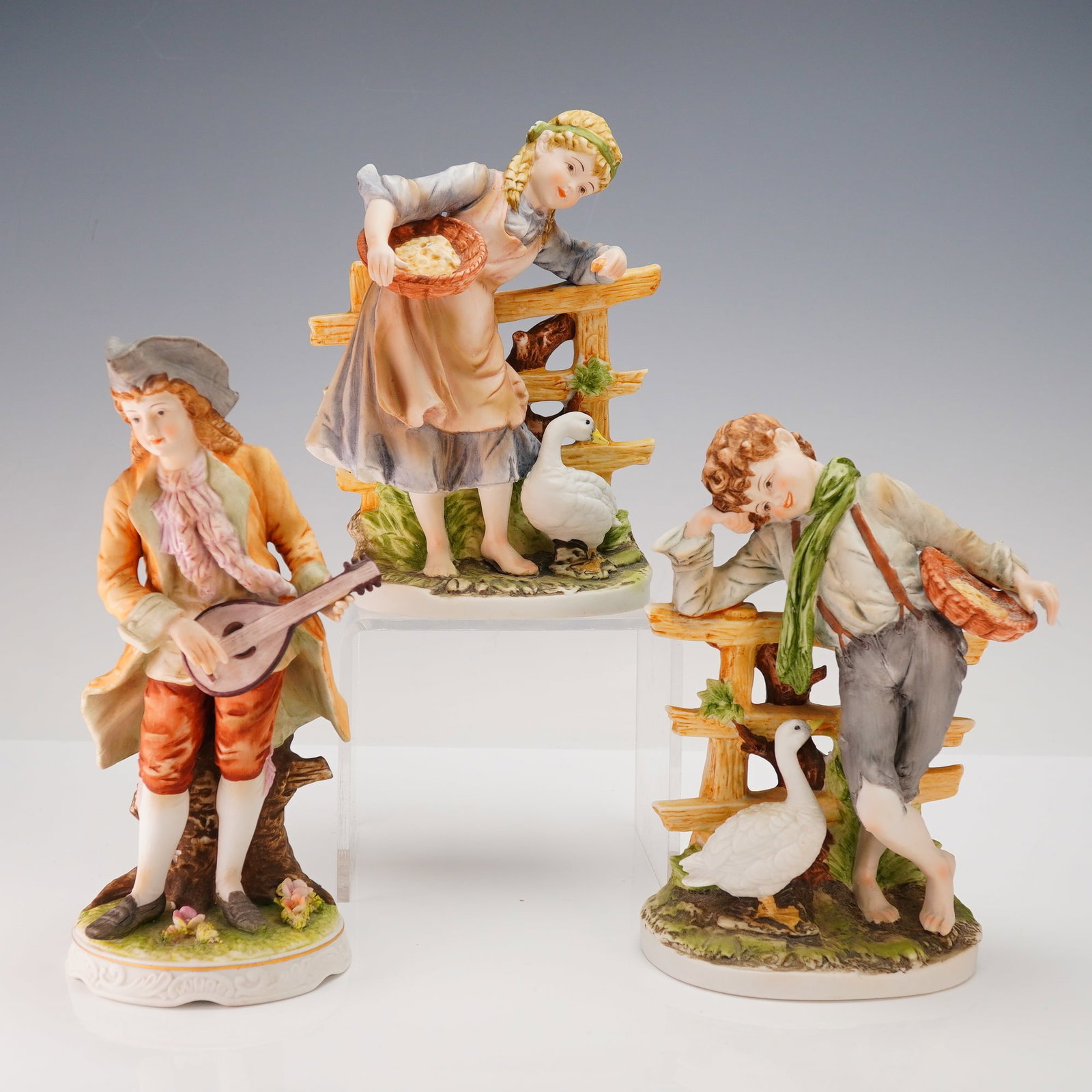 A Group of Three Polychrome Porcelain Figurines (1 of 3)