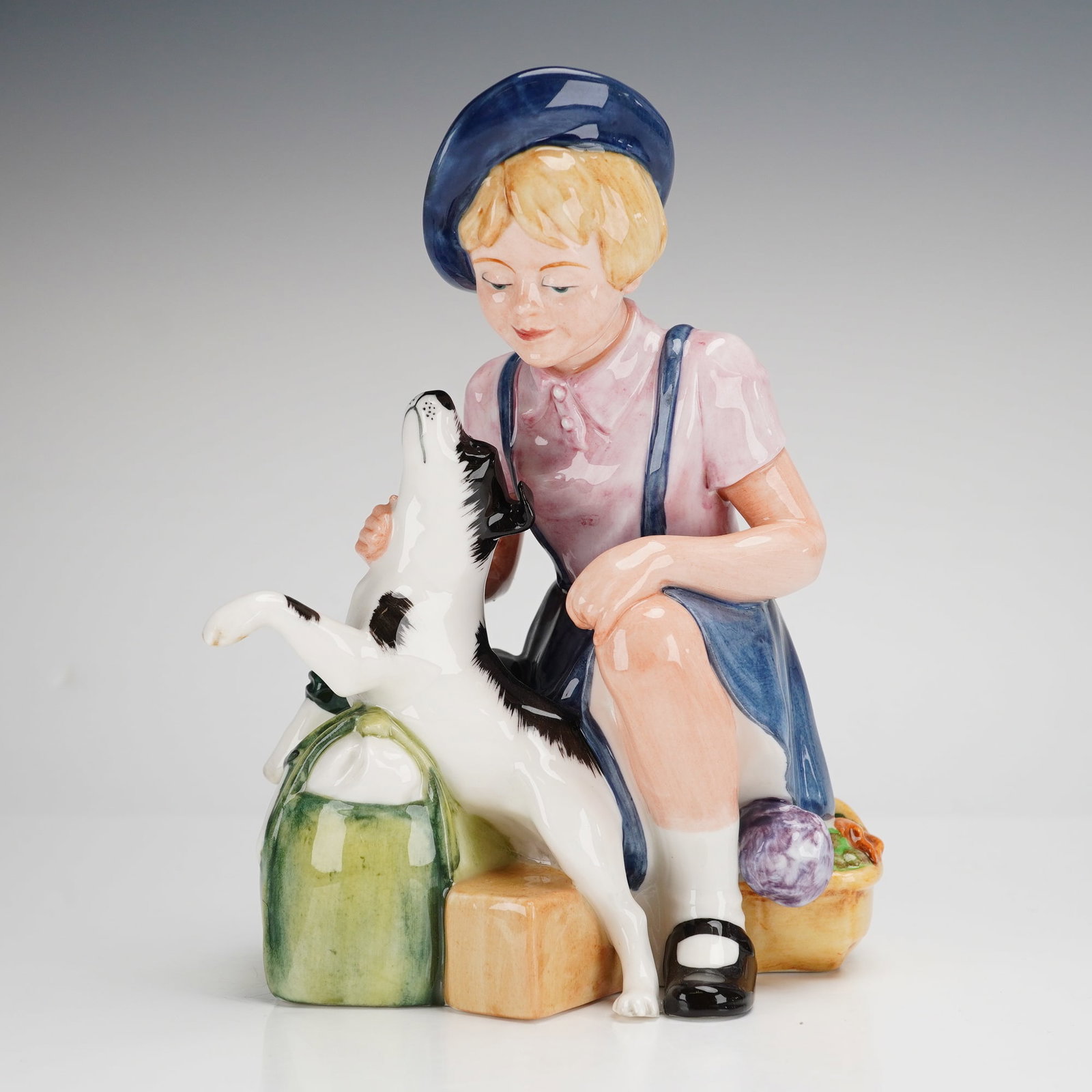 Royal Doulton Figurine The Homecoming HN3295 Signed by Michael Douton: This Royal Doulton figurine, titled The Homecoming HN3295, is a hand-decorated glazed ceramic work modeled by Adrian Hughes. The piece depicts a young girl wearing a blue beret and jumper kneeling to 