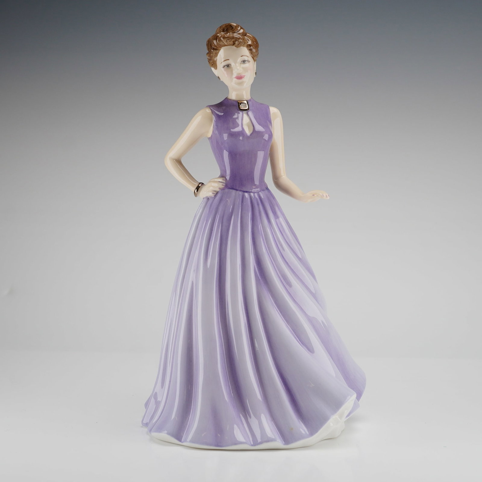 Royal Doulton Pretty Ladies Pearl Figurine HN4733: A Royal Doulton Figurine, Pretty Ladies Pearl HN4733, depicting a woman in a long lavender dress, inscribed on the bone china base with Royal Doulton backstamp. Dimensions: 4.50"L x 4.25"W x 8.50"H We