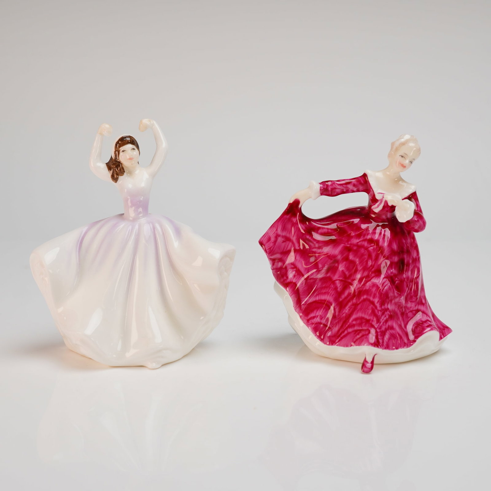 Two Royal Doulton Bone China Figurines, Kirsty (HN3213) and Karen (HN3270): Two Royal Doulton glazed bone china figurines including the patterns Kirsty (HN3213) and Karen (HN3270). The Kirsty figurine is a colorway, designed by Peggy Davies and bearing a 1970 copyright date, 