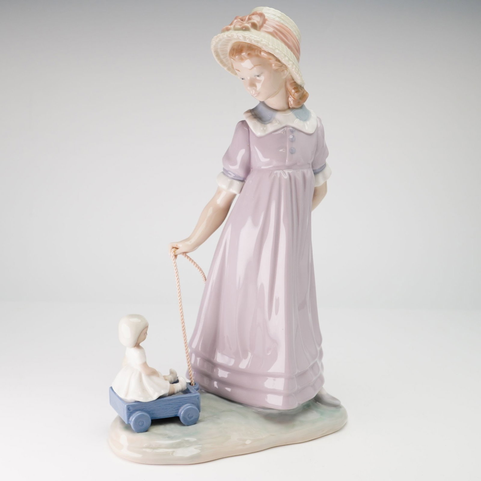 Lladro Porcelain Figurine Girl with Toy Wagon 01005044 (1 of 3)